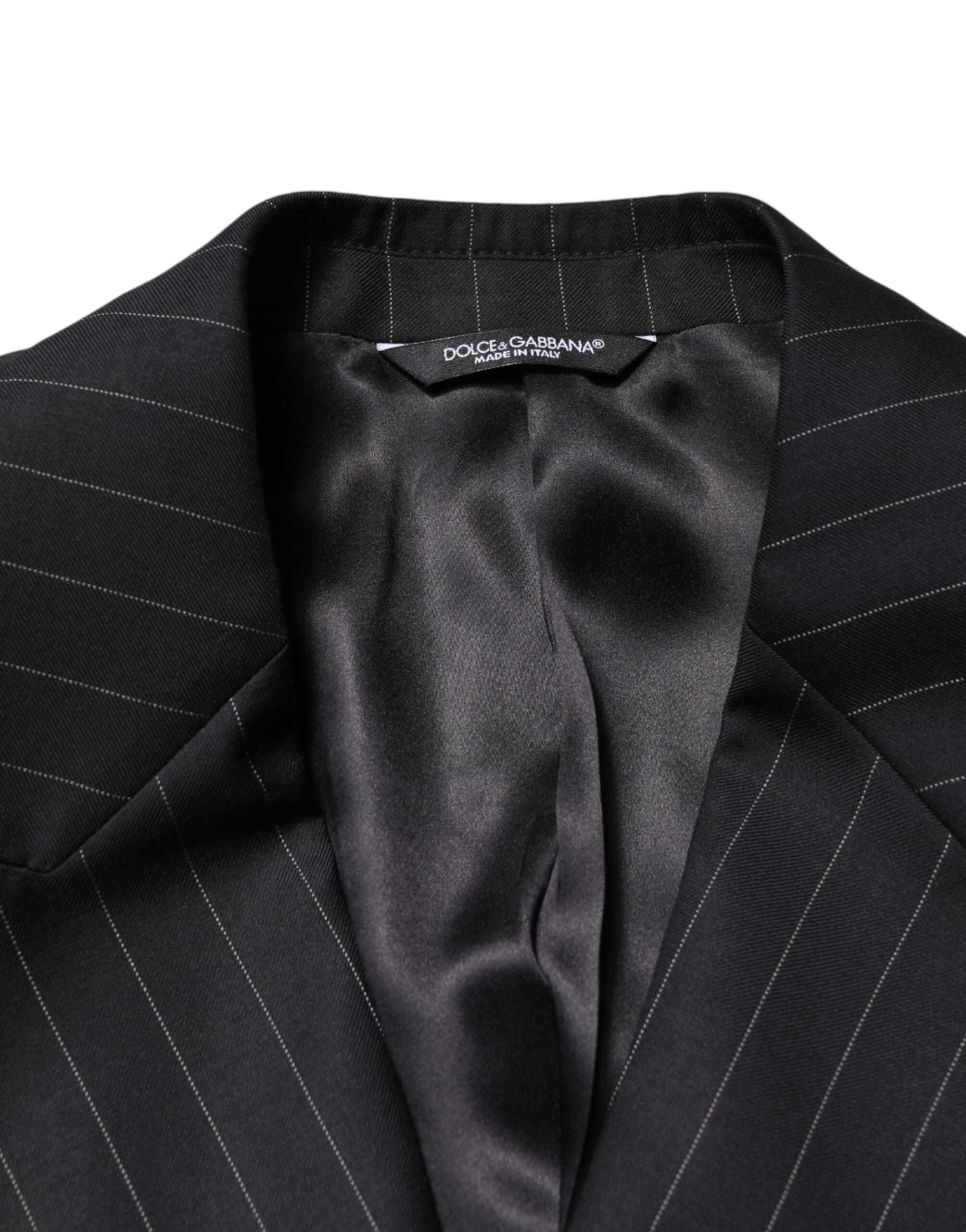 Indulge in the exquisite Dolce & Gabbana Black Stripes Double Breasted Blazer, crafted from luxurious virgin wool and silk, embodying timeless Italian elegance for the discerning individual.