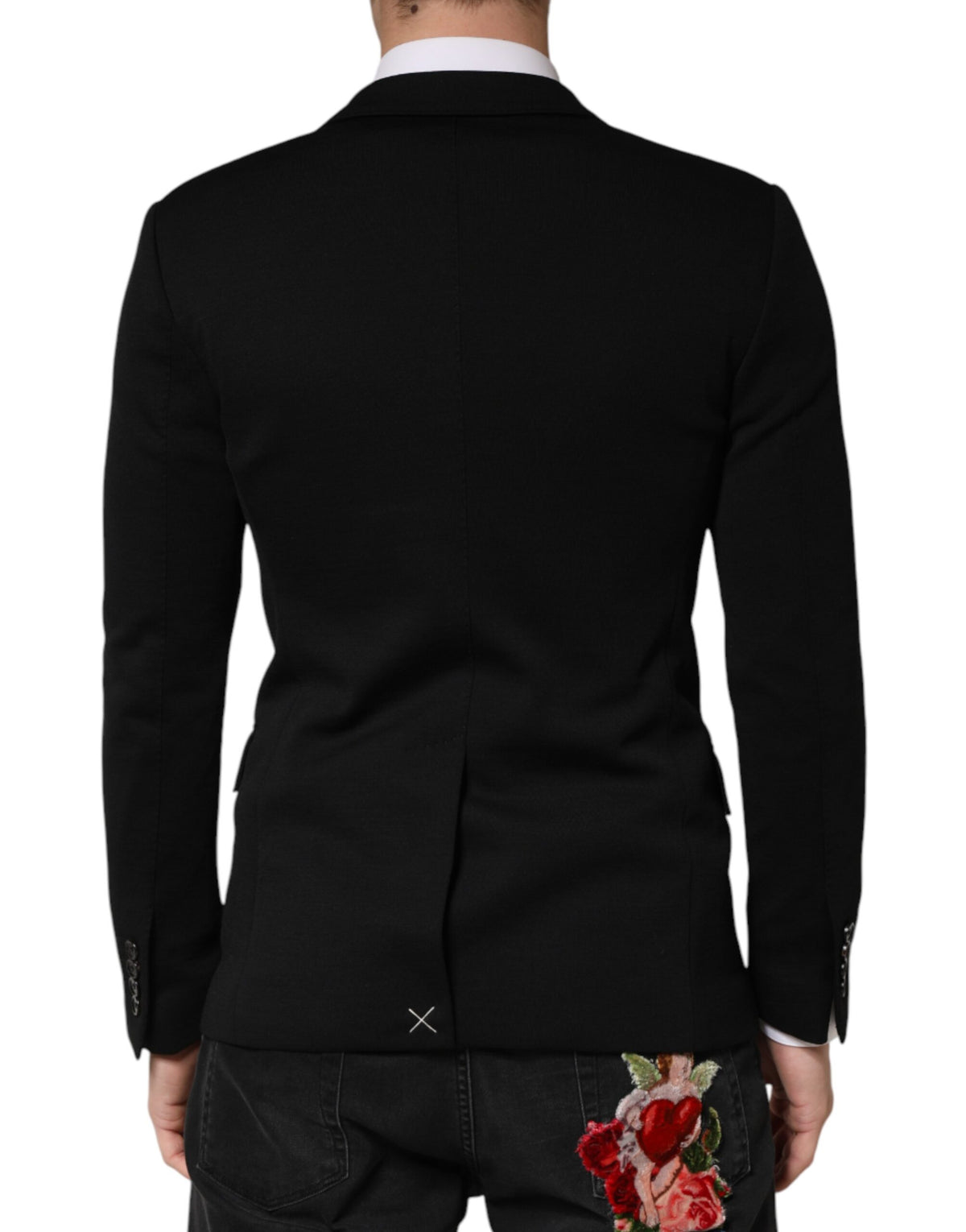 Indulge in the exquisite craftsmanship of the Dolce & Gabbana Black Wool Blazer, a timeless piece that embodies luxury and sophistication for discerning individuals.
