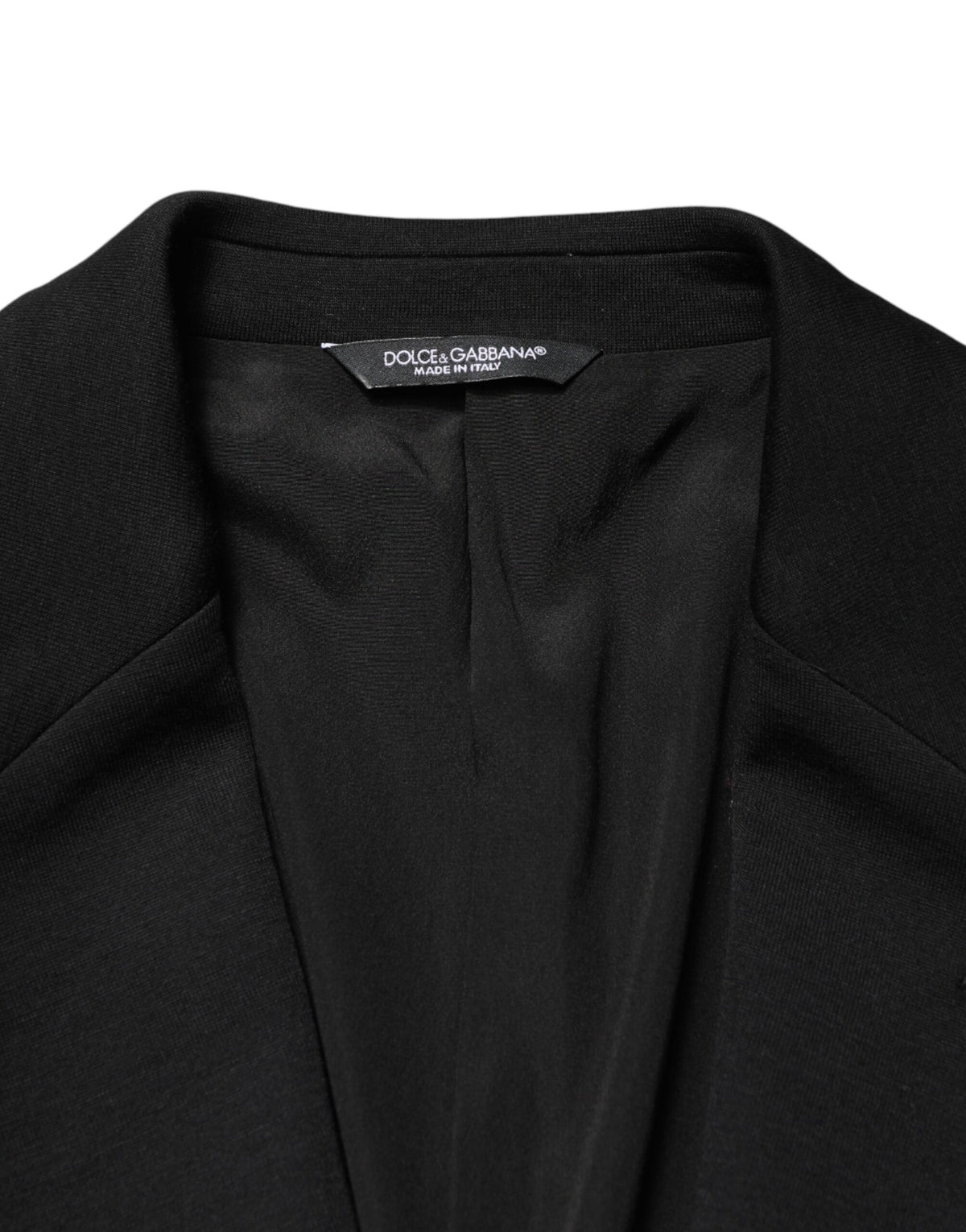 Indulge in the exquisite allure of the Dolce & Gabbana Black Wool Blazer, a timeless masterpiece crafted in Italy, embodying luxury and sophistication for the discerning individual.