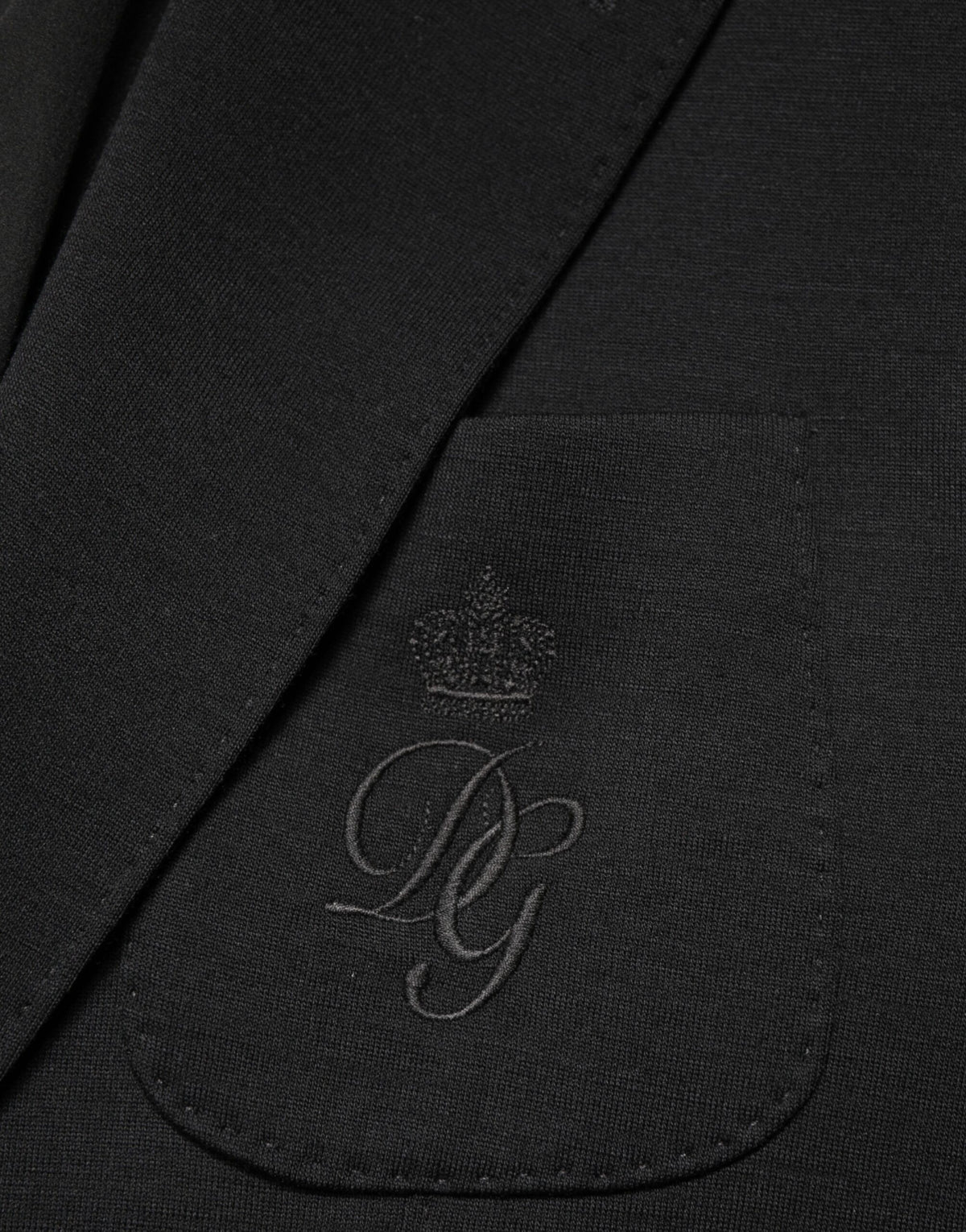 Indulge in the exquisite Dolce & Gabbana Black Wool Single Breasted Blazer, a timeless masterpiece of Italian craftsmanship that elevates your style with unparalleled sophistication.