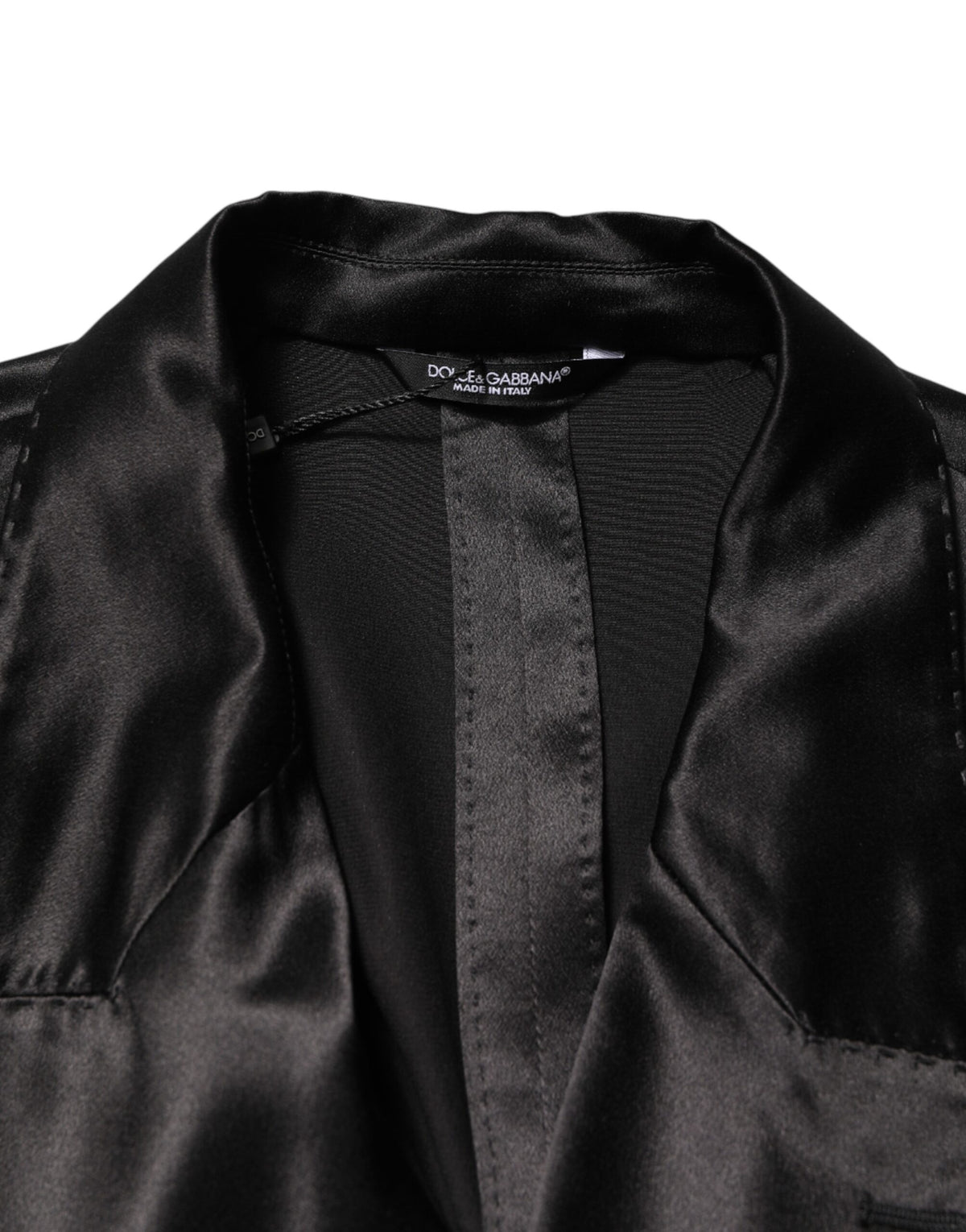 Elevate your style with the Dolce & Gabbana Black Silk Double Breasted Blazer, a timeless piece of Italian craftsmanship that embodies sophistication and allure.