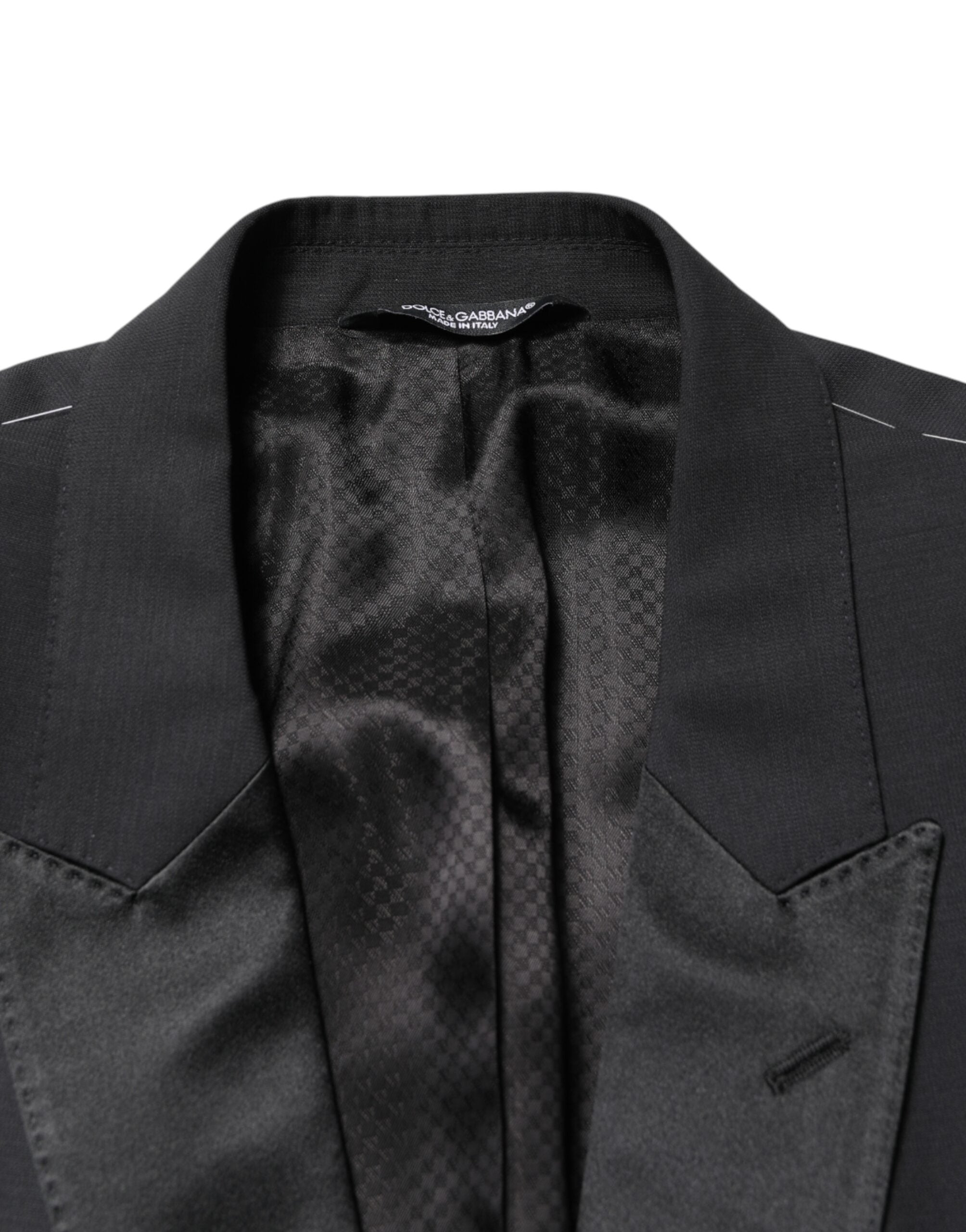 Experience the allure of Dolce & Gabbana's Black MARTINI Blazer, a masterpiece of luxury tailoring crafted from premium virgin wool and silk, perfect for the discerning individual.