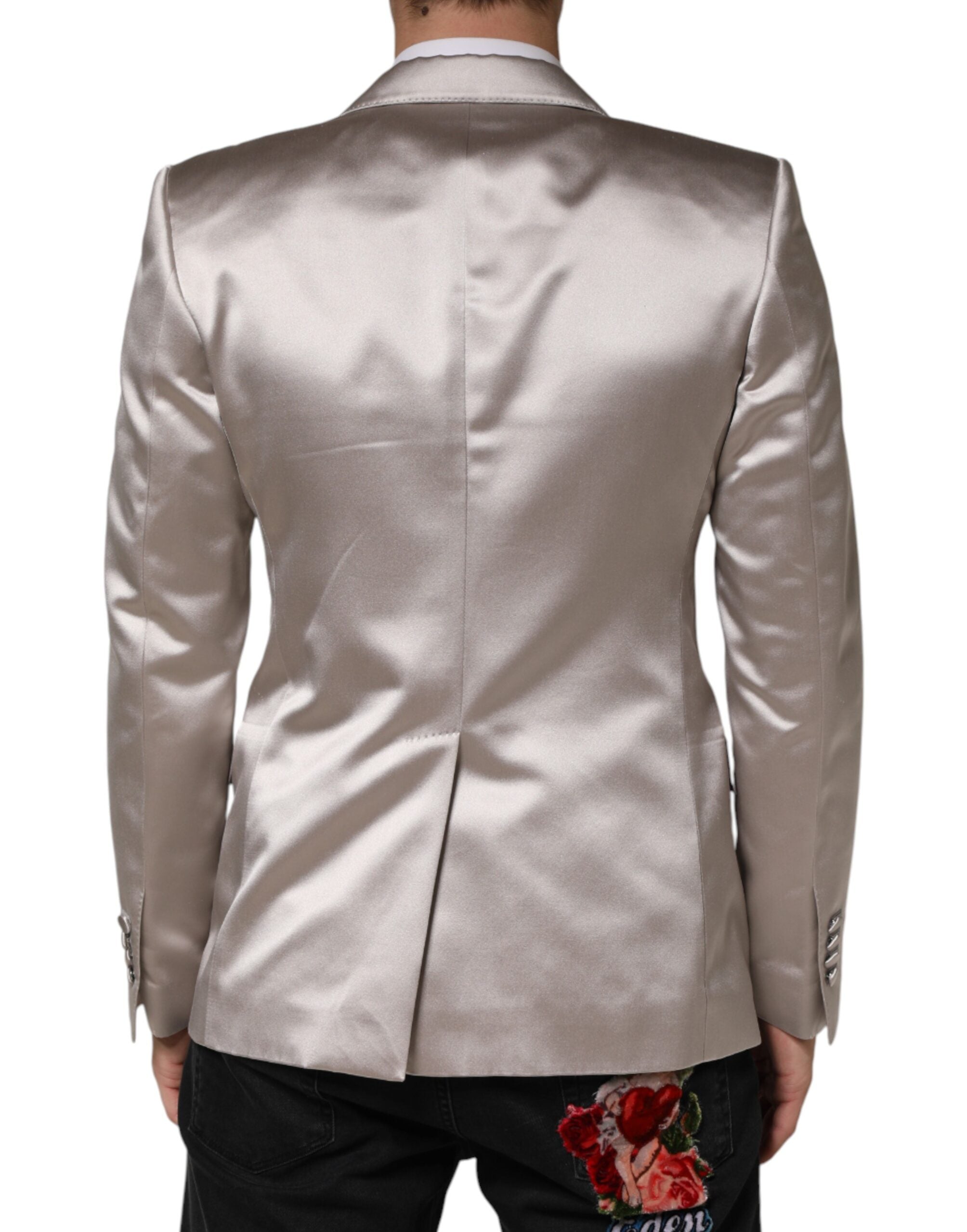 Discover the Dolce & Gabbana Silver SICILIA Blazer, a masterpiece of silk craftsmanship that embodies timeless elegance and sophisticated allure for discerning individuals.