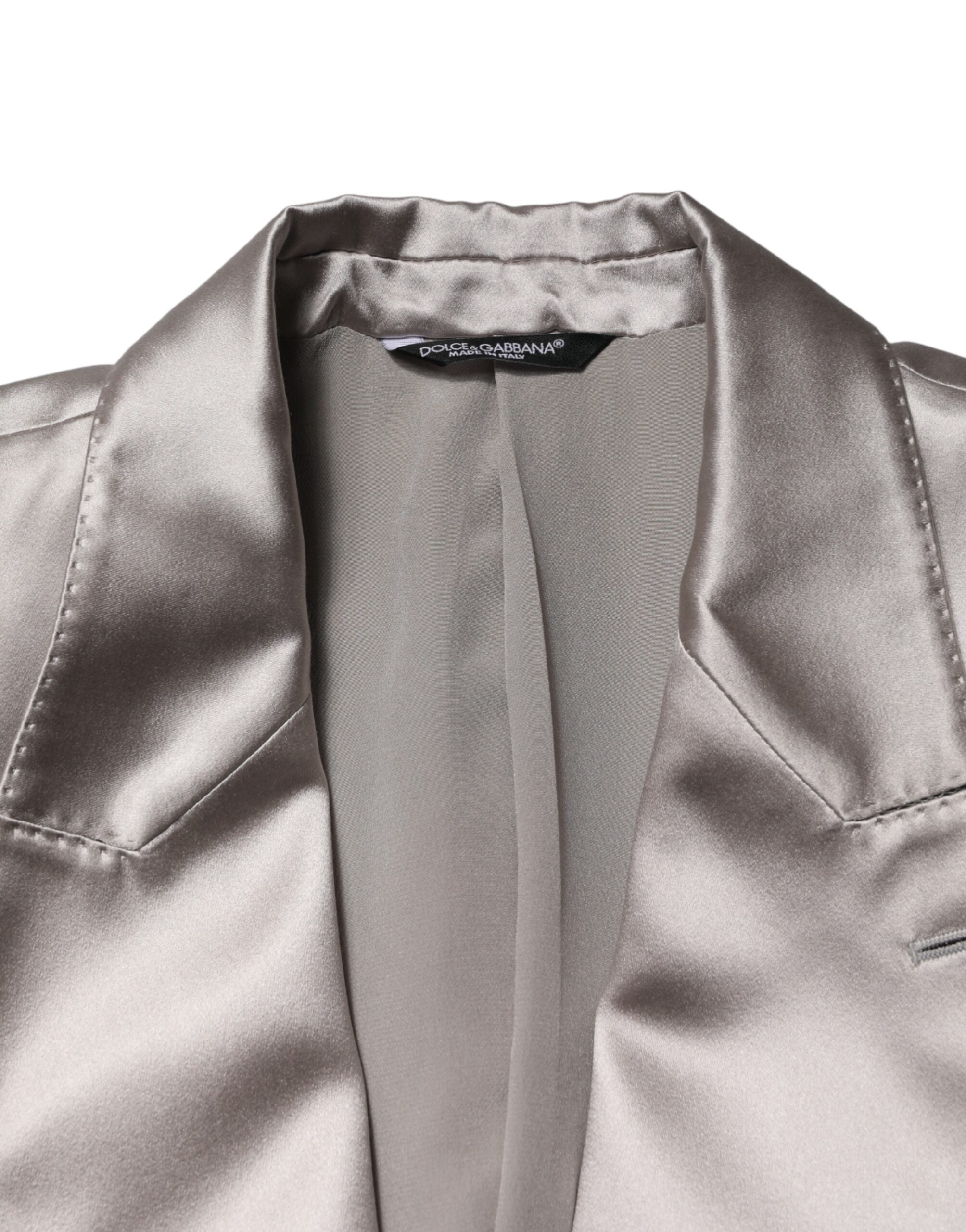 Elevate your wardrobe with the Dolce & Gabbana Silver SICILIA Blazer, a masterpiece of silk craftsmanship that embodies timeless elegance and sophisticated allure.