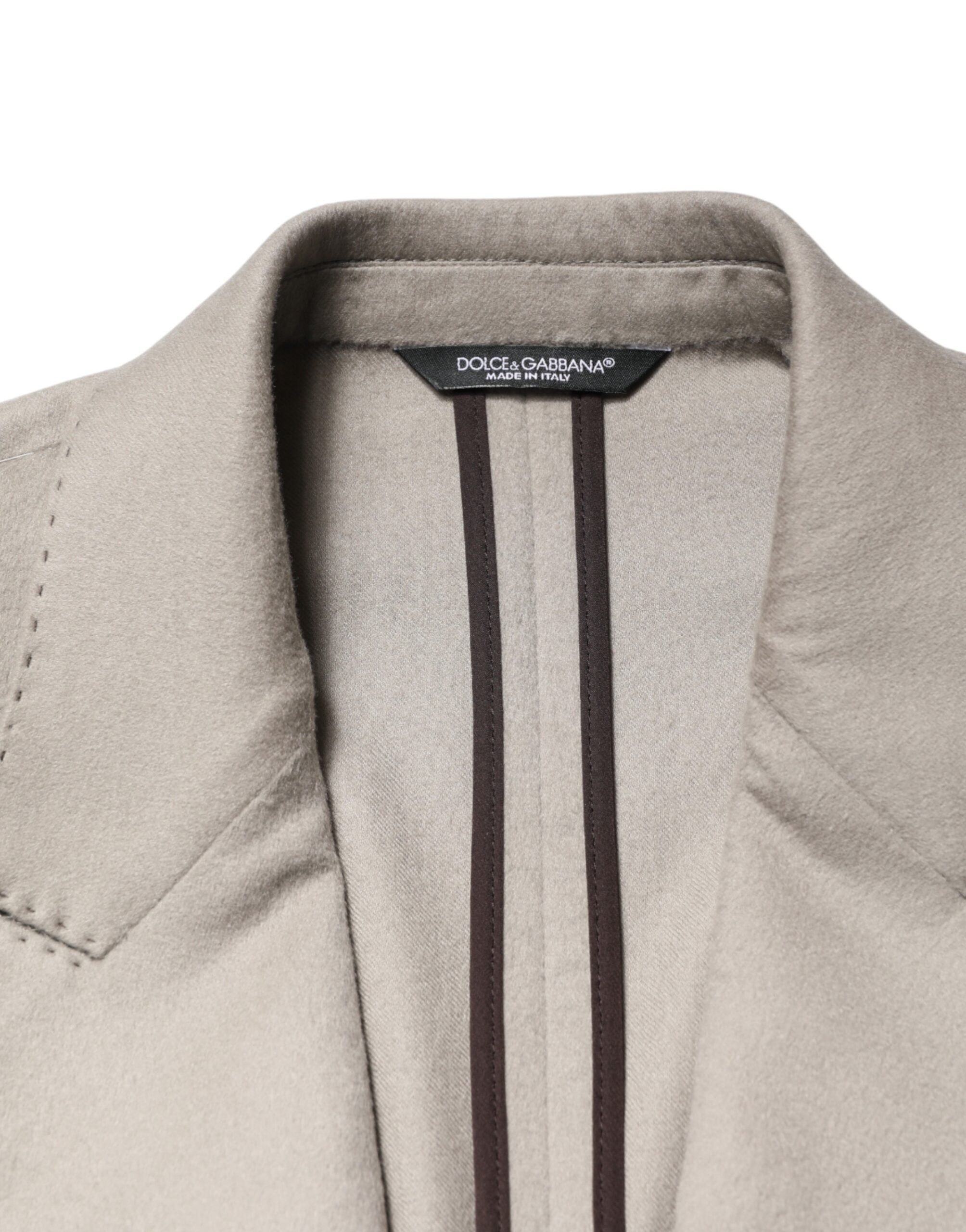 Elevate your wardrobe with the Dolce & Gabbana Gray Cashmere Single Breasted Jacket, a testament to Italian craftsmanship and timeless luxury, perfect for any discerning individual.