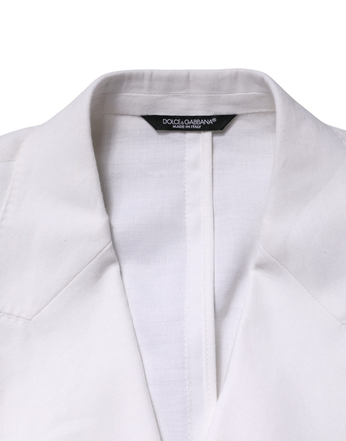 Elevate your wardrobe with the Dolce & Gabbana White Linen Double Breasted Blazer, a masterpiece of Italian craftsmanship that embodies timeless elegance and sophisticated allure.