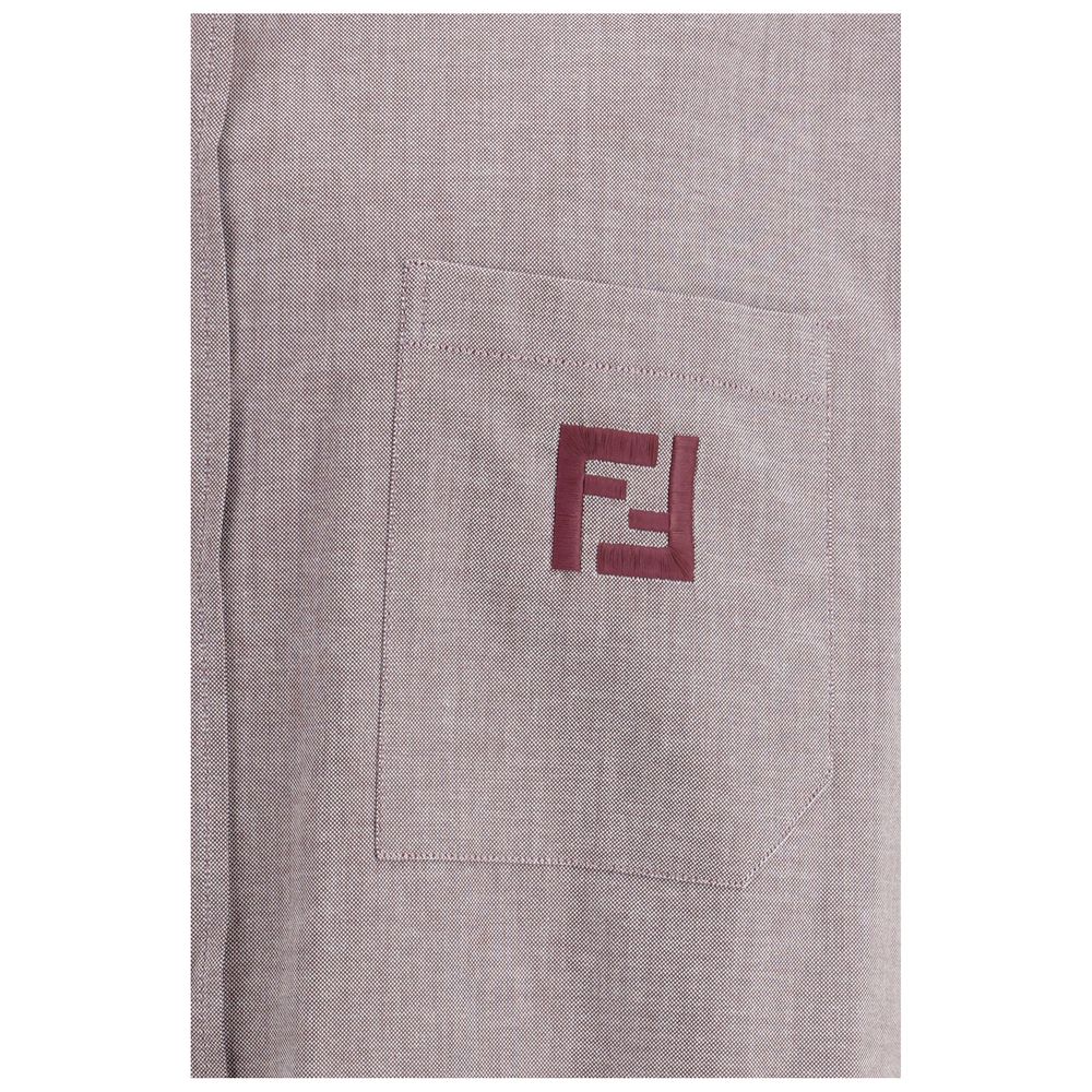 Indulge in the Fendi Bordeaux Cotton Shirt, an oversized masterpiece of iridescent burgundy cotton, embodying luxury and sophistication for the discerning individual.