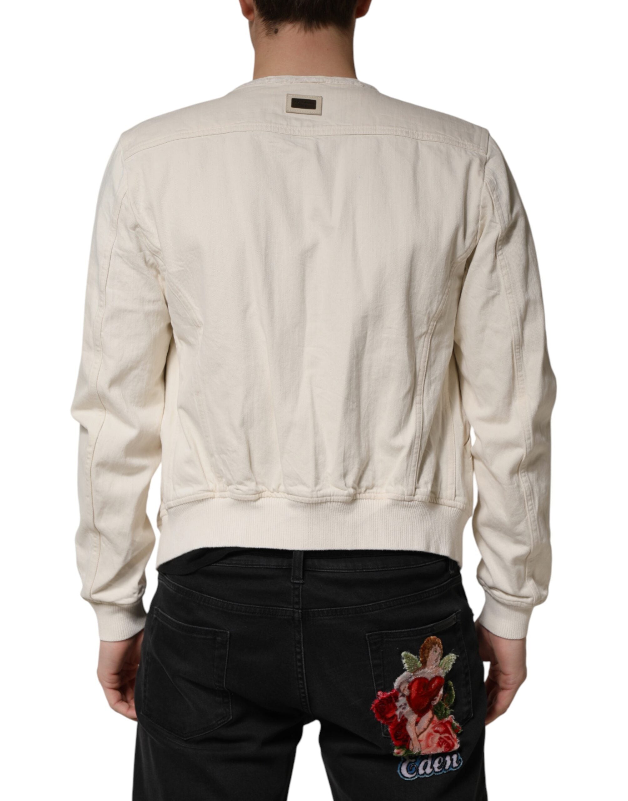 Discover the Dolce & Gabbana Off White Cotton Full Zip Denim Blouson Jacket, a testament to Italian craftsmanship that elevates your wardrobe with timeless elegance.