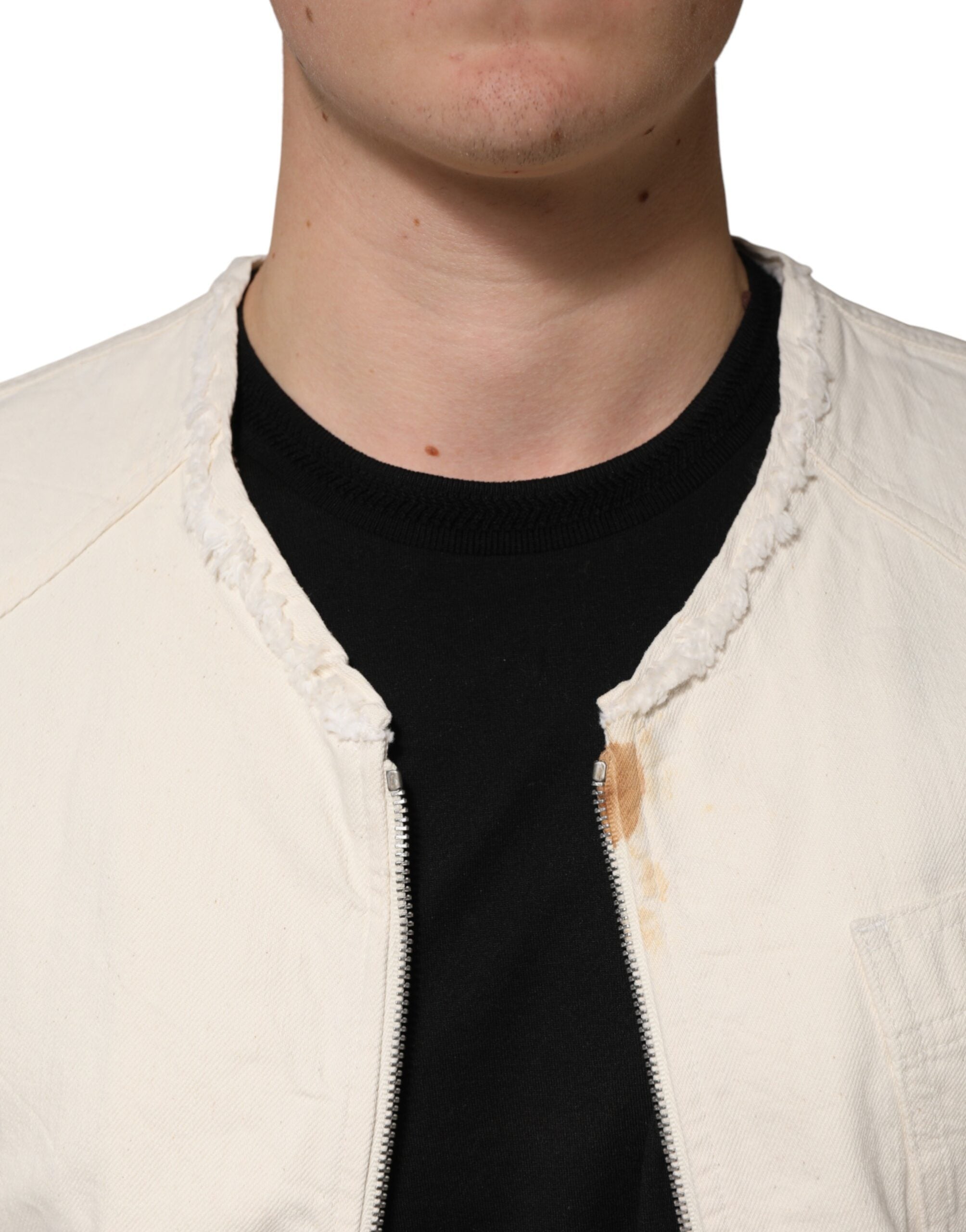 Discover the Dolce & Gabbana Off White Cotton Full Zip Denim Blouson Jacket, a masterpiece of Italian craftsmanship that elevates your wardrobe with luxurious elegance.