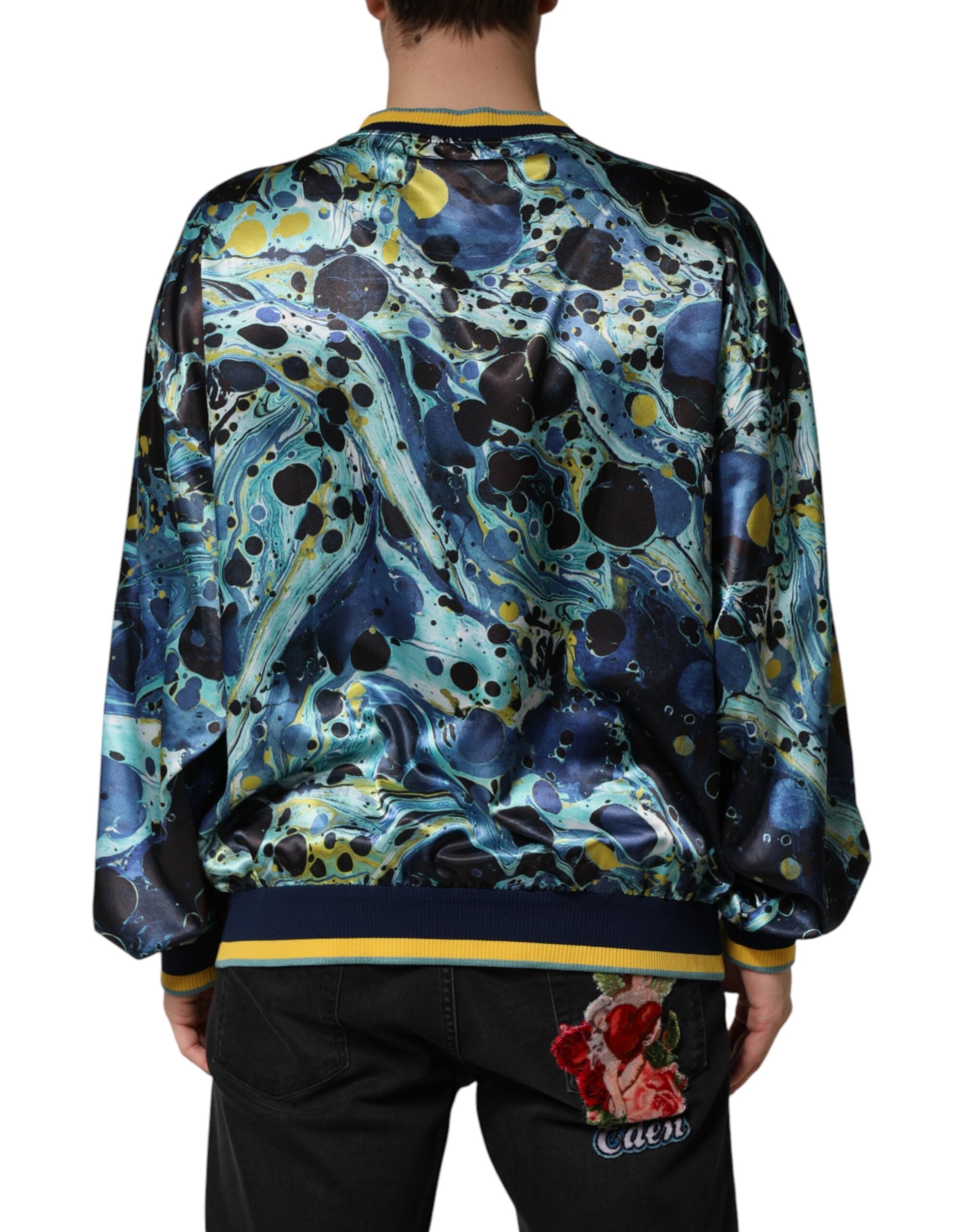 Indulge in the exquisite Dolce & Gabbana Multicolor Marble Print Pullover Sweater, a masterpiece of Italian craftsmanship blending luxurious polyester and elastane for effortless elegance.