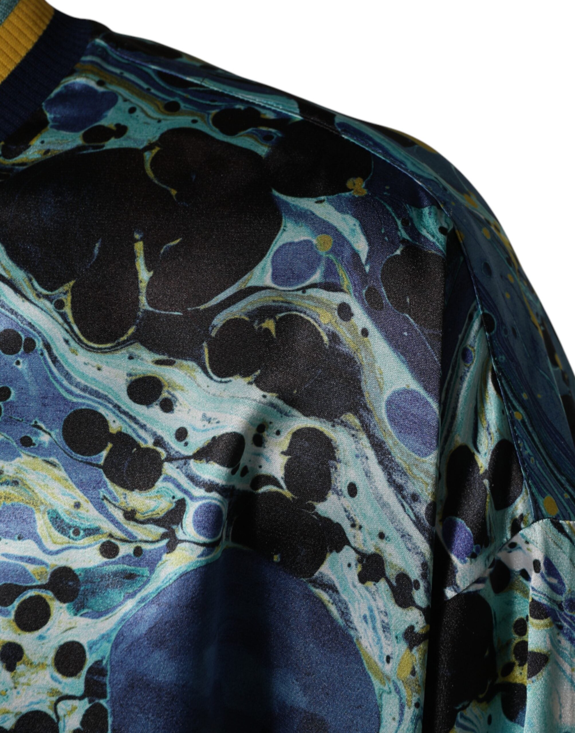 Indulge in the exquisite Dolce & Gabbana Multicolor Marble Print Pullover Sweater, a masterpiece of Italian craftsmanship blending luxurious polyester and elastane for effortless elegance.