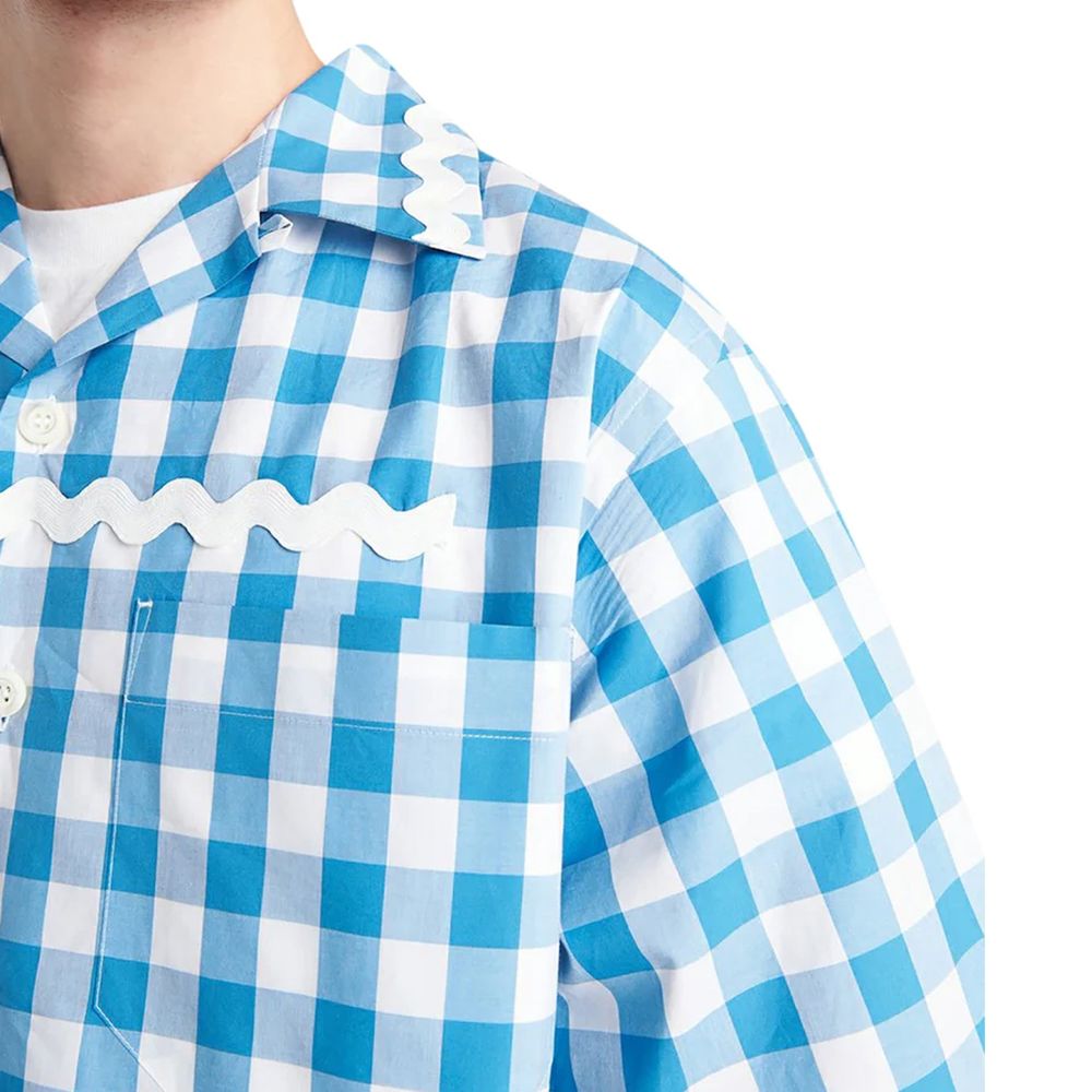 Experience the allure of the Prada Blue Cotton Pattern Shirt, a masterpiece of Italian craftsmanship in luxurious cotton, perfect for the discerning individual seeking timeless elegance.
