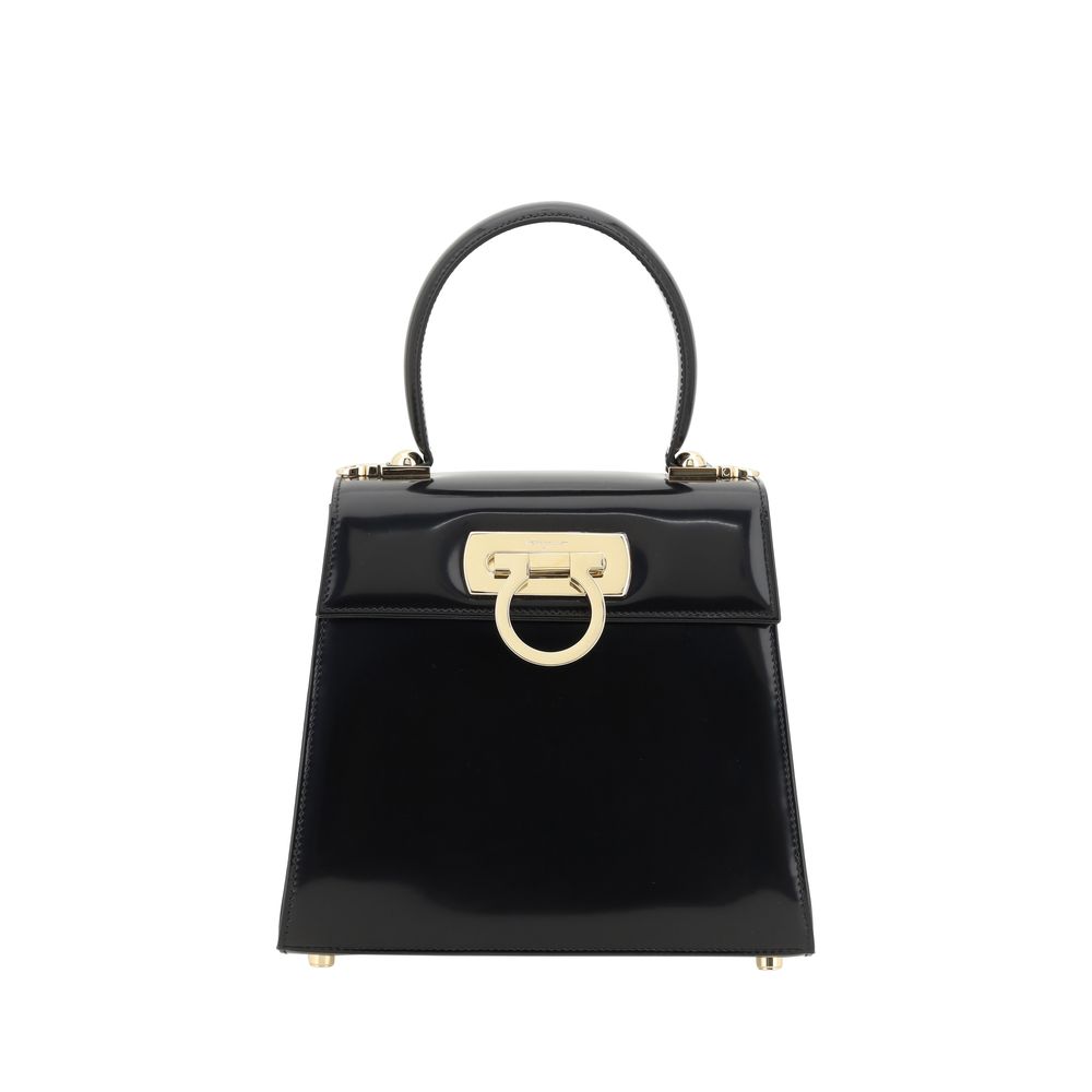 Experience the exquisite craftsmanship of the Ferragamo Black Calf Leather Bos Taurus Handbag, a timeless symbol of luxury and sophistication for the discerning individual.
