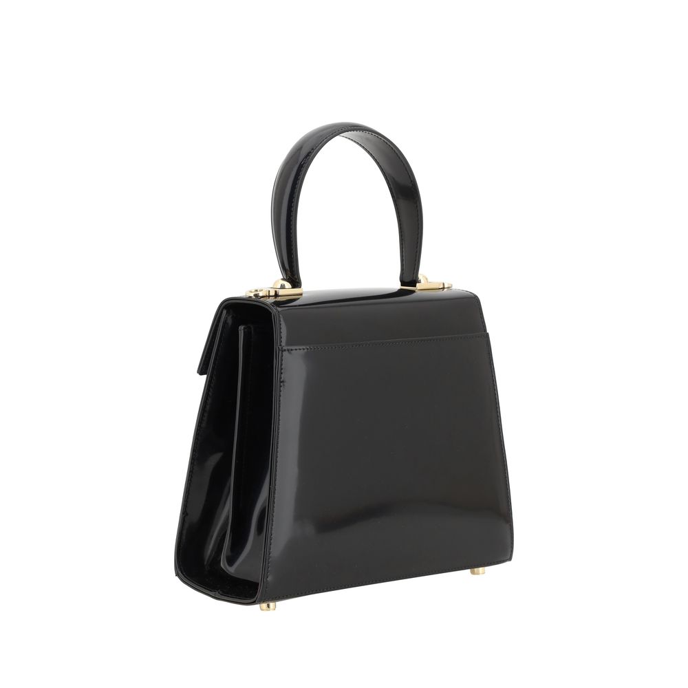 Experience the exquisite craftsmanship of the Ferragamo Black Calf Leather Bos Taurus Handbag, a timeless piece that embodies luxury and sophistication for the discerning individual.
