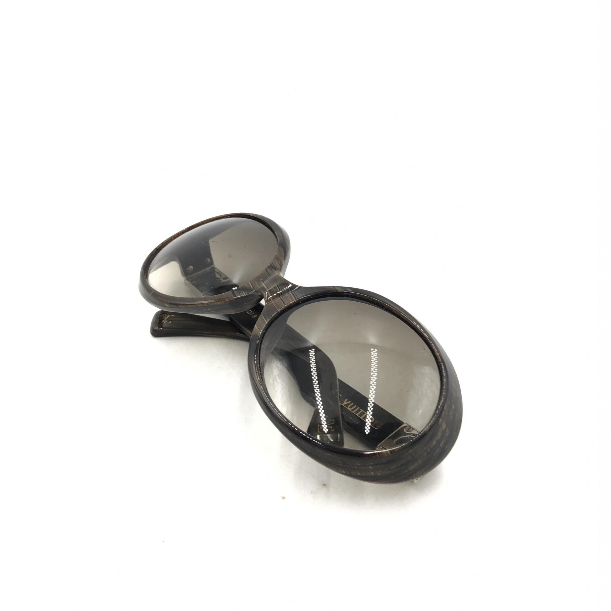 Elevate your style with Louis Vuitton's Suspense BugEye Sunglasses, featuring polarized lenses and exquisite craftsmanship, a timeless statement of luxury and sophistication.