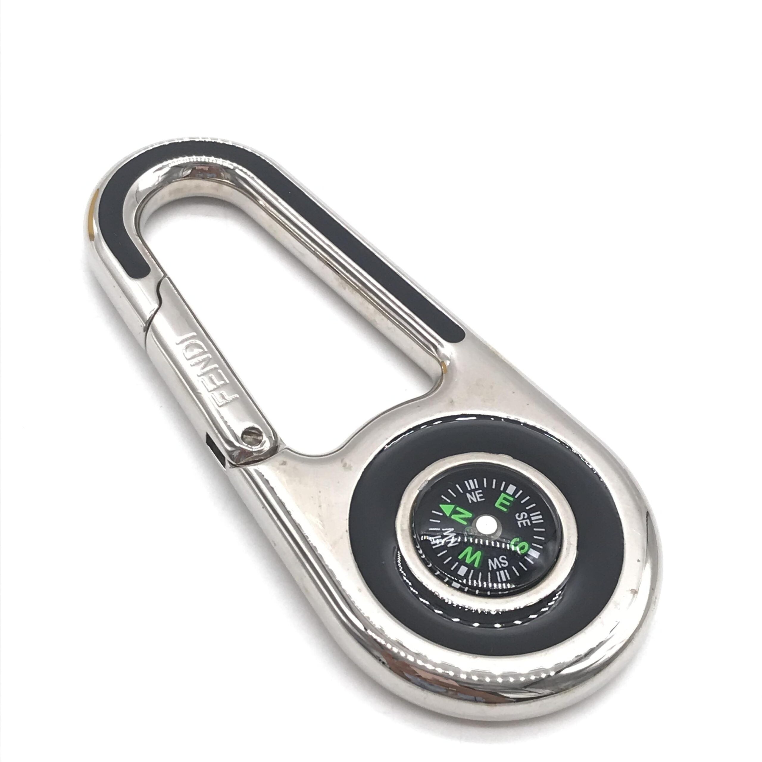 Elevate your style with the Fendi Silver Metal Compass Charm Keychain, a symbol of luxury and exquisite craftsmanship, perfect for the discerning adventurer.