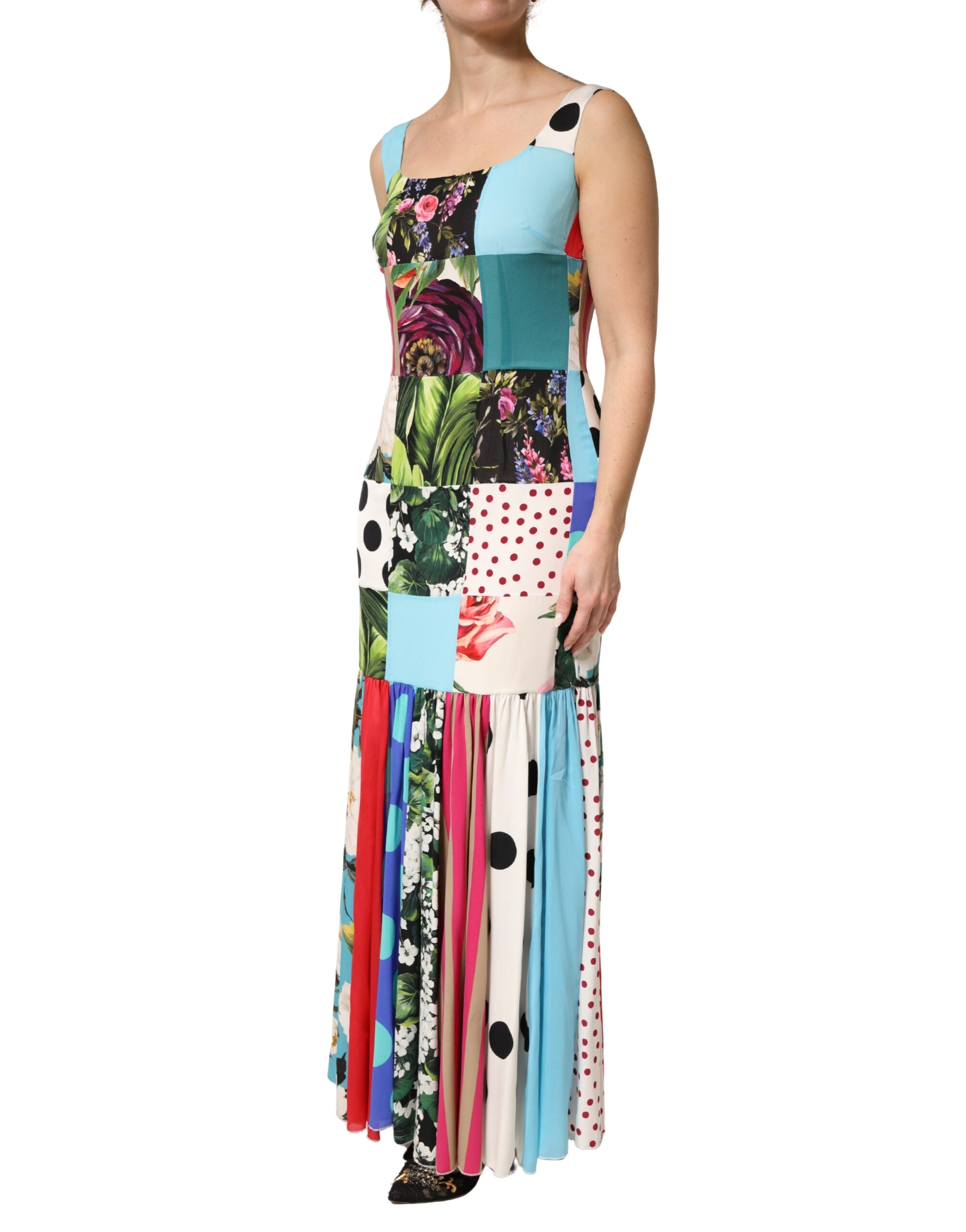 Indulge in the Dolce & Gabbana Multicolor Patchwork Silk Sleeveless Dress, a masterpiece of Italian haute couture, blending luxurious silk with exquisite craftsmanship for an unforgettable statement.