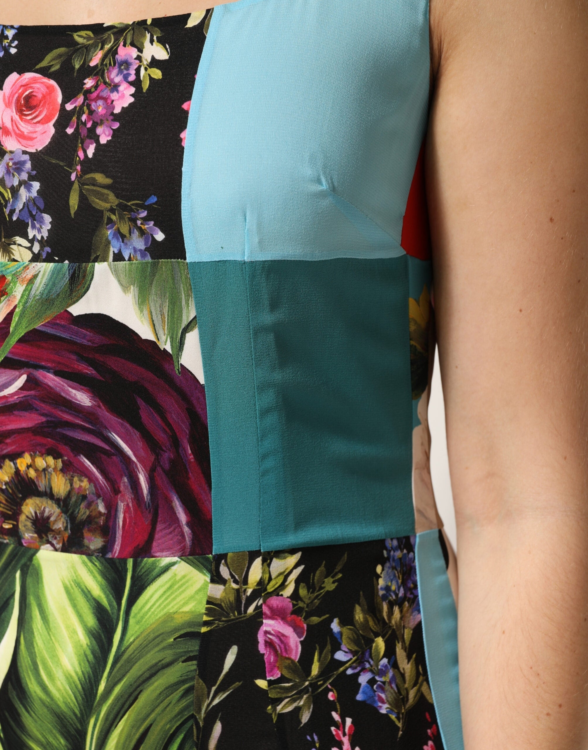 Experience the allure of the Dolce & Gabbana Multicolor Patchwork Silk Sleeveless Dress, where exquisite craftsmanship meets luxurious silk for an unforgettable statement.