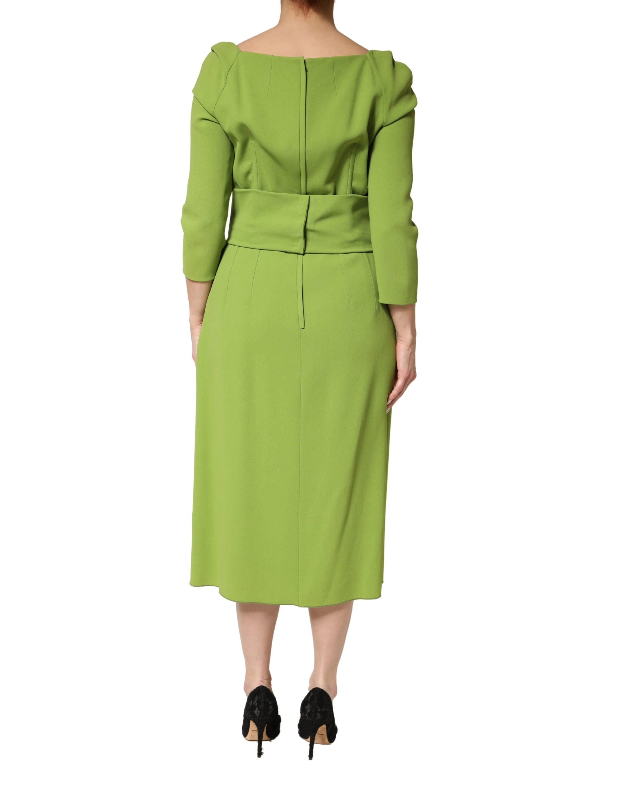 Experience the exquisite allure of the Dolce & Gabbana Green Silk Sweetheart Neckline Midi Dress, a masterpiece of Italian craftsmanship that redefines elegance for any occasion.