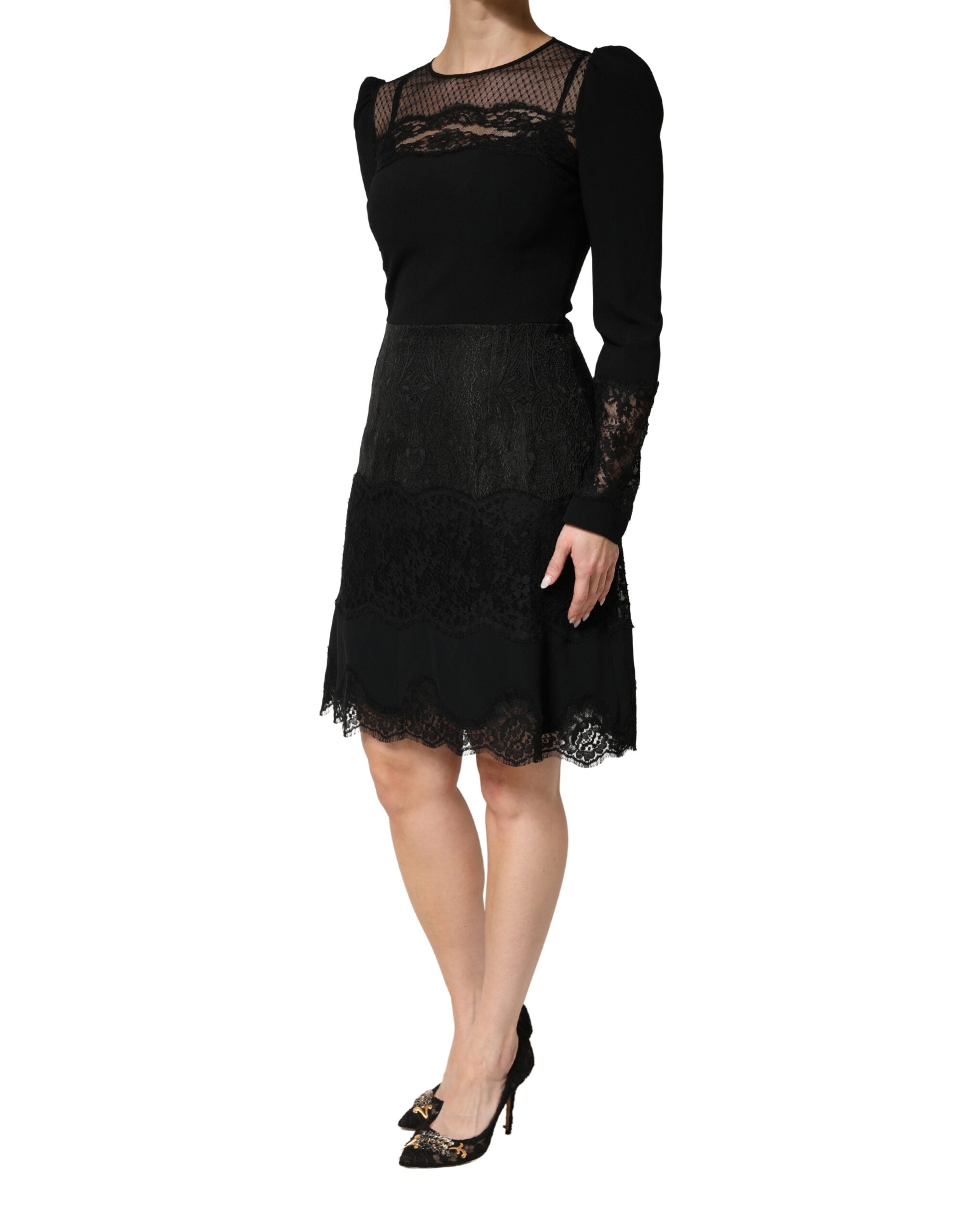 Indulge in the exquisite allure of the Dolce & Gabbana Black Lace Sheer Panel Midi Dress, a testament to Italian craftsmanship and luxurious femininity, perfect for unforgettable evenings.