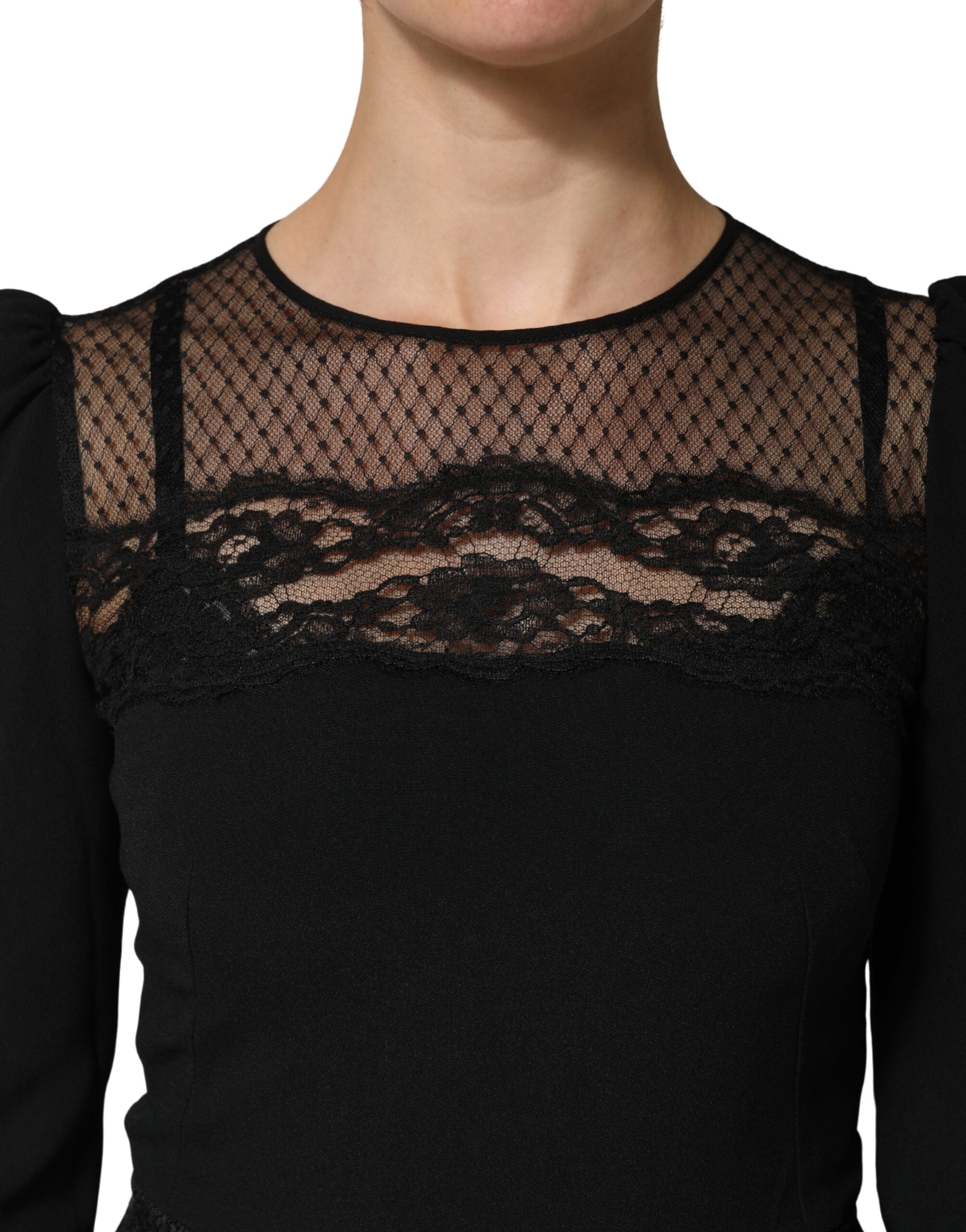Indulge in the exquisite Dolce & Gabbana Black Lace Sheer Panel Midi Dress, crafted in Italy from luxurious materials, embodying timeless elegance and sophisticated allure.