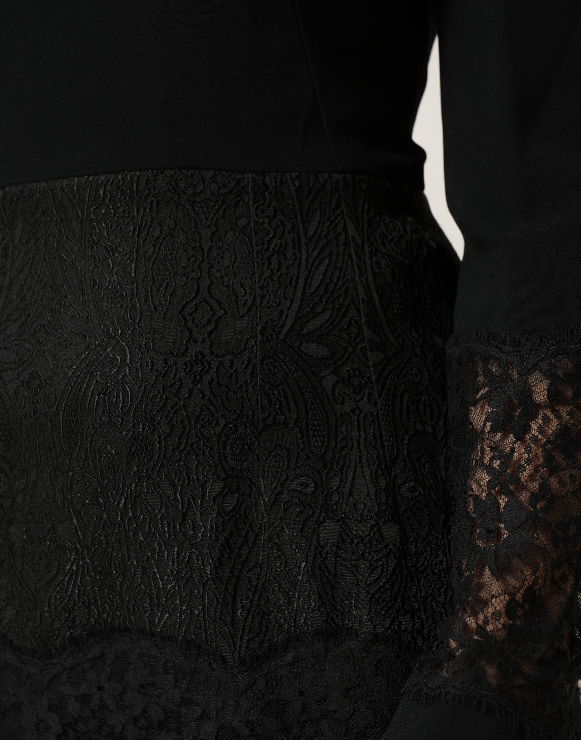 Discover the Dolce & Gabbana Black Lace Sheer Panel Midi Dress, a masterpiece of Italian craftsmanship, blending luxurious materials for timeless elegance and allure.