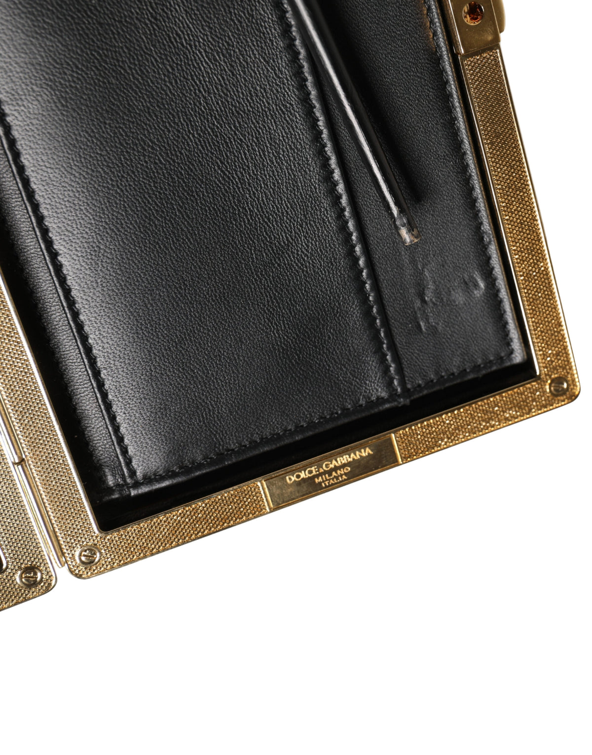 Indulge in the exquisite allure of the Dolce & Gabbana White Lambskin Leather Clutch, a timeless accessory crafted in Italy that elevates your evening elegance with luxurious sophistication.