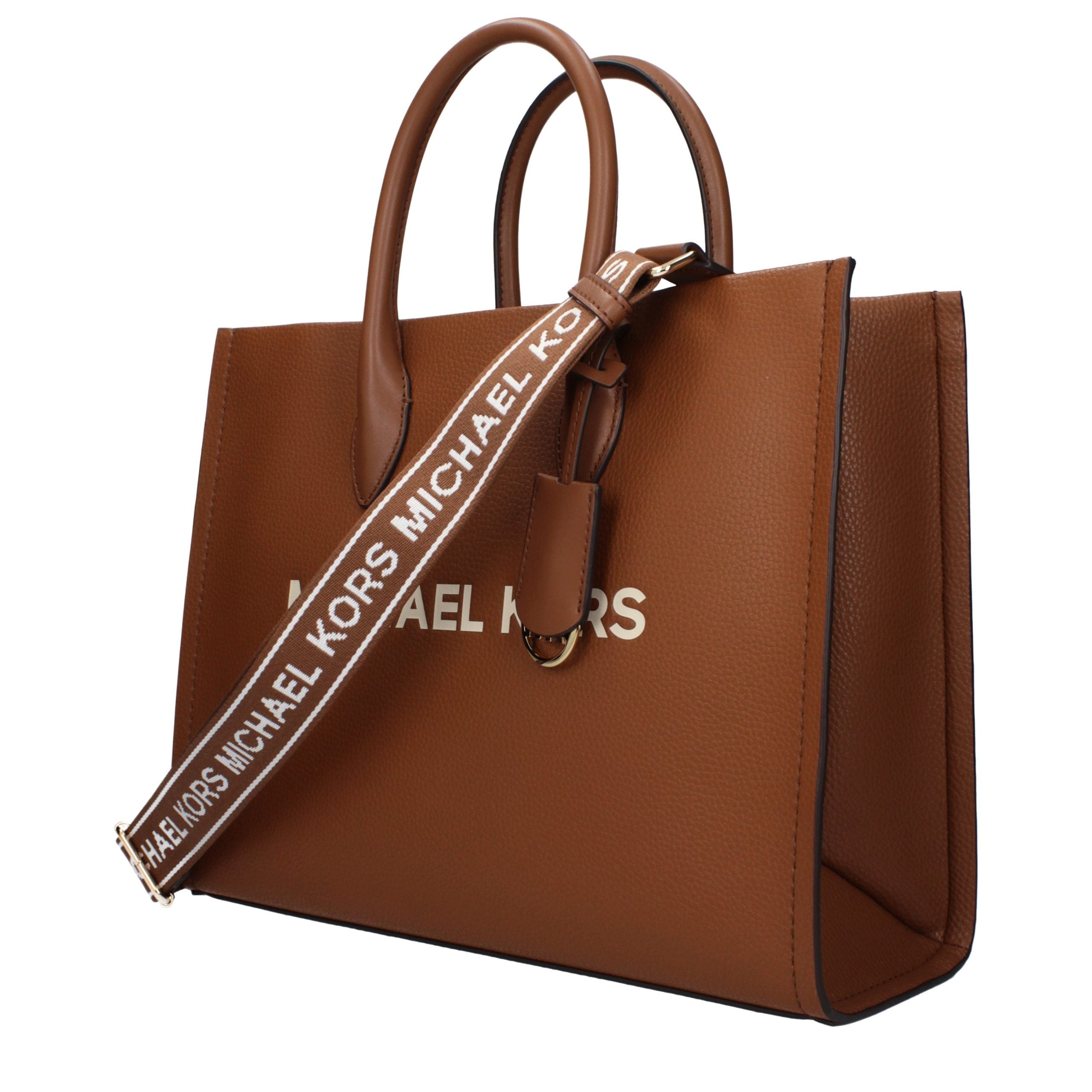 Discover the Michael Kors Brown Leather Handbag, a timeless blend of luxury craftsmanship and elegance, perfect for those who embody sophistication and style.