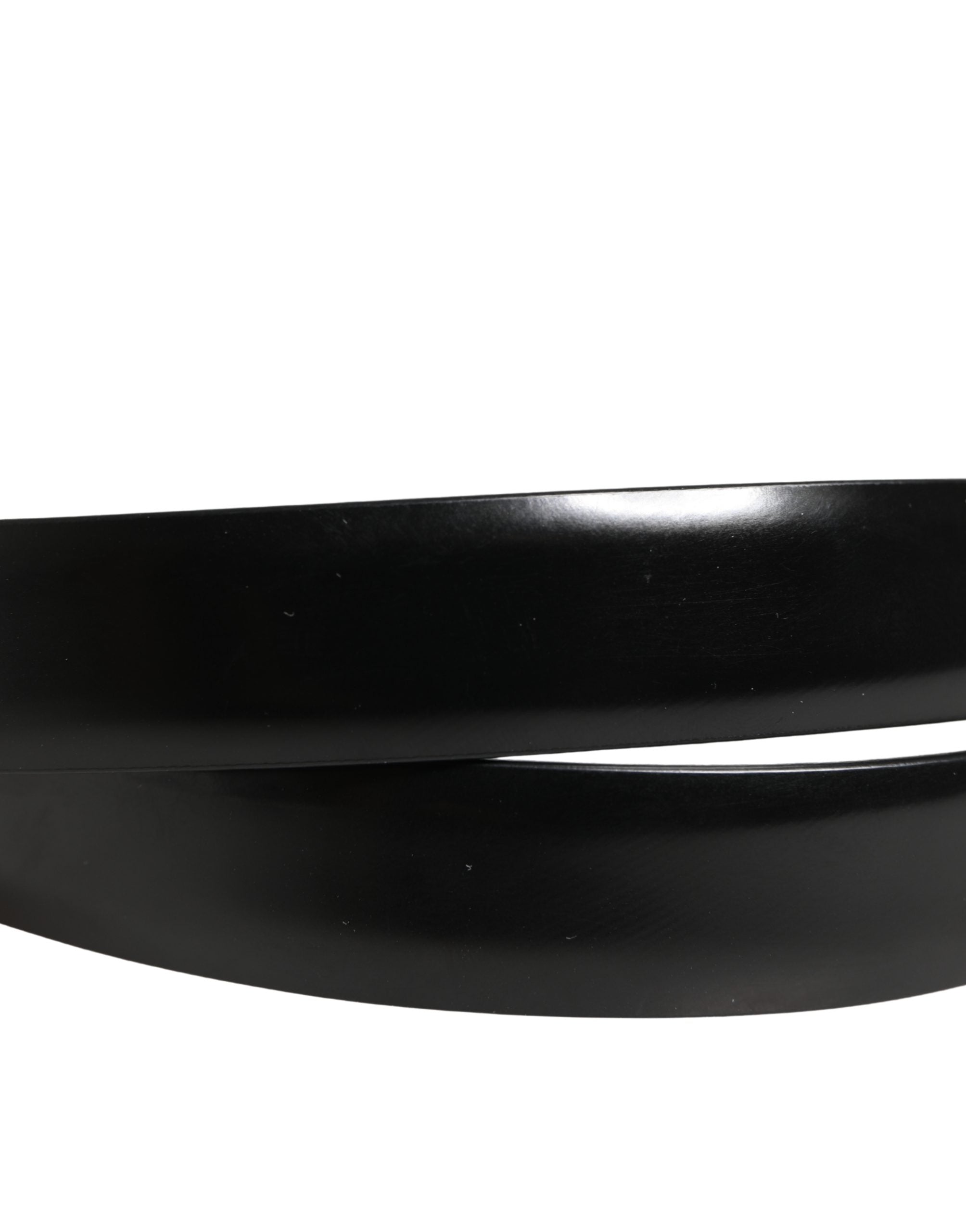 Elevate your style with the Dolce & Gabbana Men Black Classic Leather Metal Buckle Belt, a masterpiece of Italian craftsmanship in luxurious calf leather, perfect for the discerning individual.