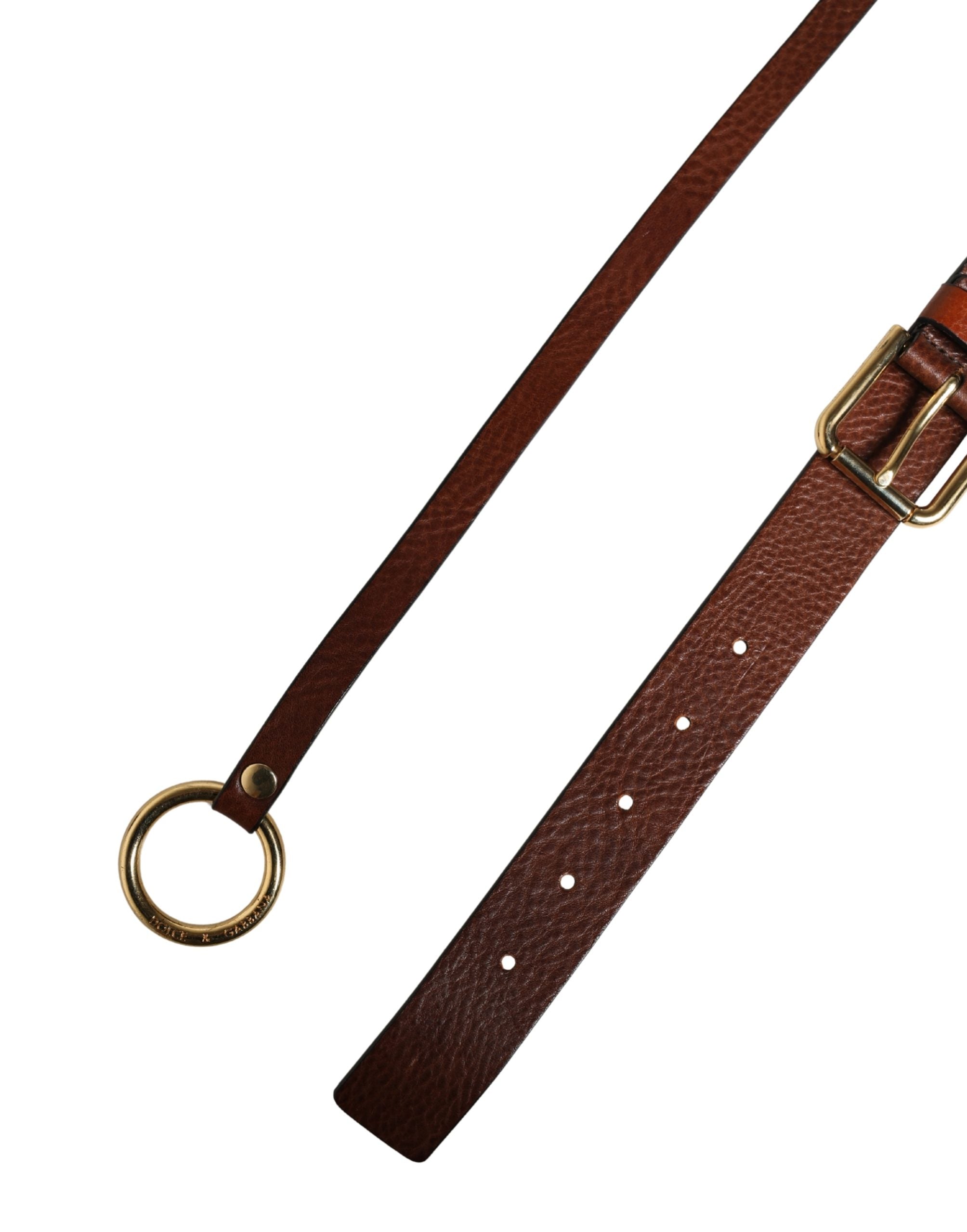 Discover the Dolce & Gabbana Men Brown Classic Leather Metal Buckle Belt, a masterpiece of Italian craftsmanship in luxurious calf leather, embodying timeless elegance and sophistication.