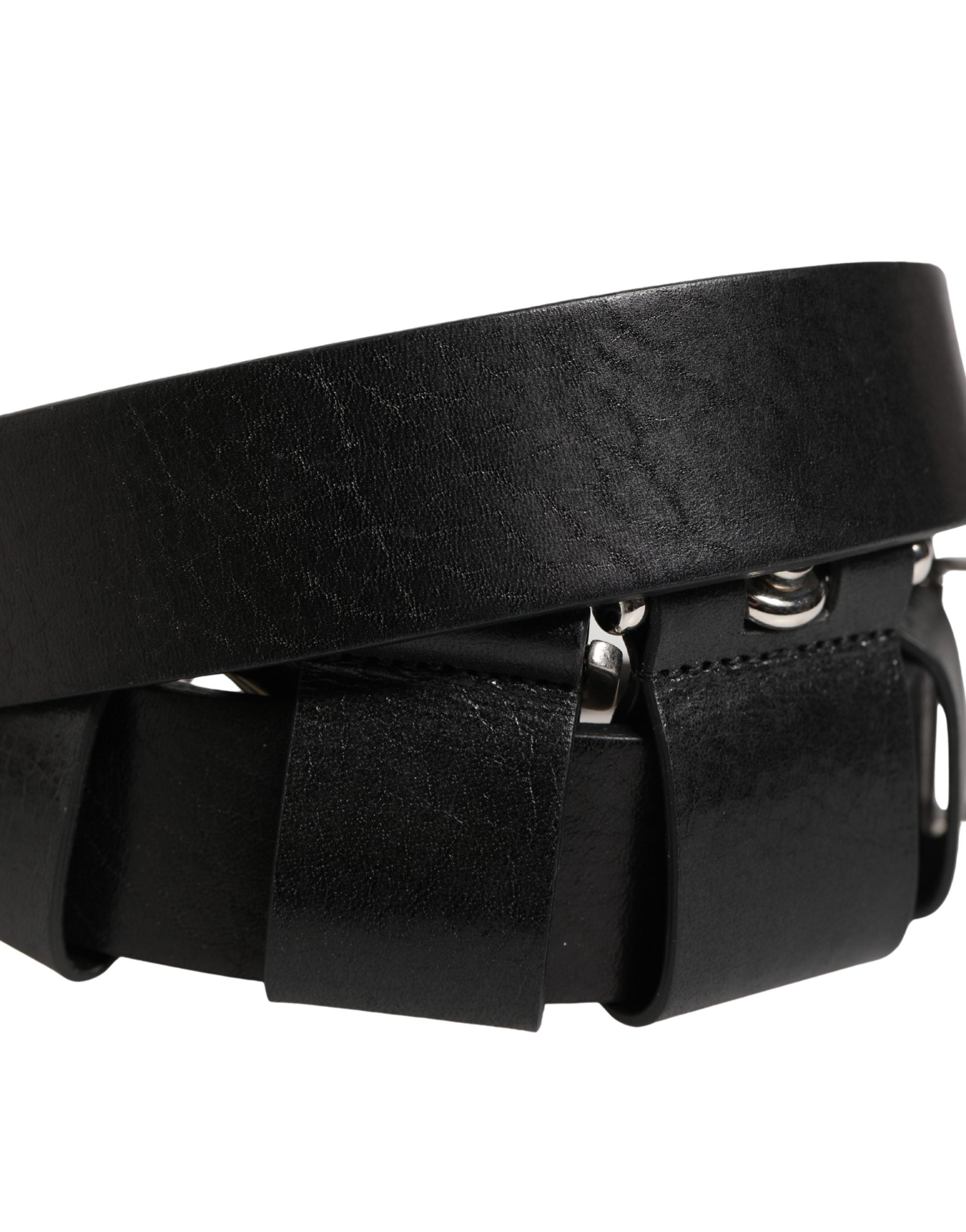 Discover the Dolce & Gabbana Black Calf Leather Silver Metal Buckle Belt, a timeless luxury accessory that embodies exquisite Italian craftsmanship and elevates any ensemble.