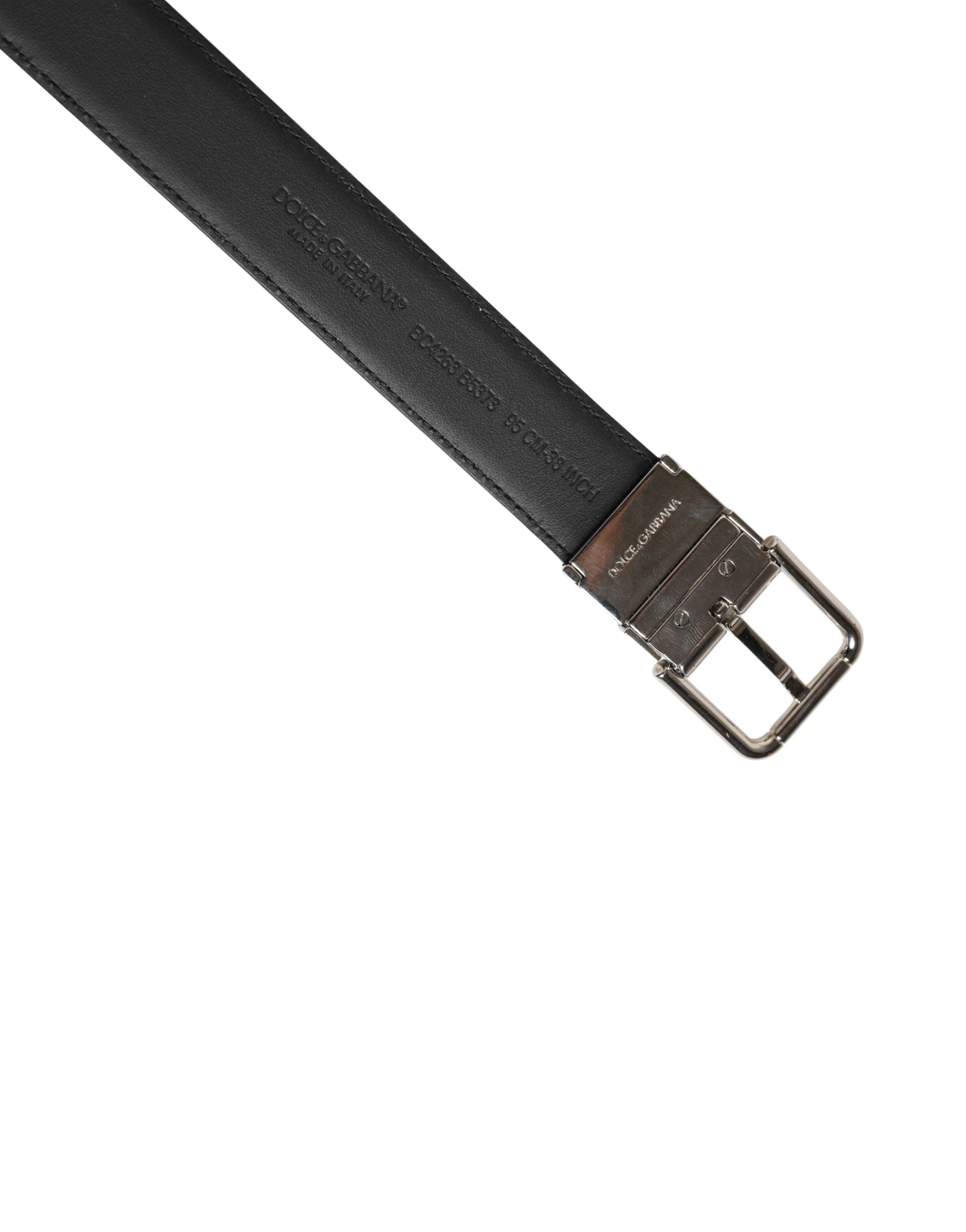 Elevate your style with the Dolce & Gabbana Men Black Classic Leather Metal Buckle Belt, a masterpiece of Italian craftsmanship in luxurious calf leather, embodying timeless elegance.