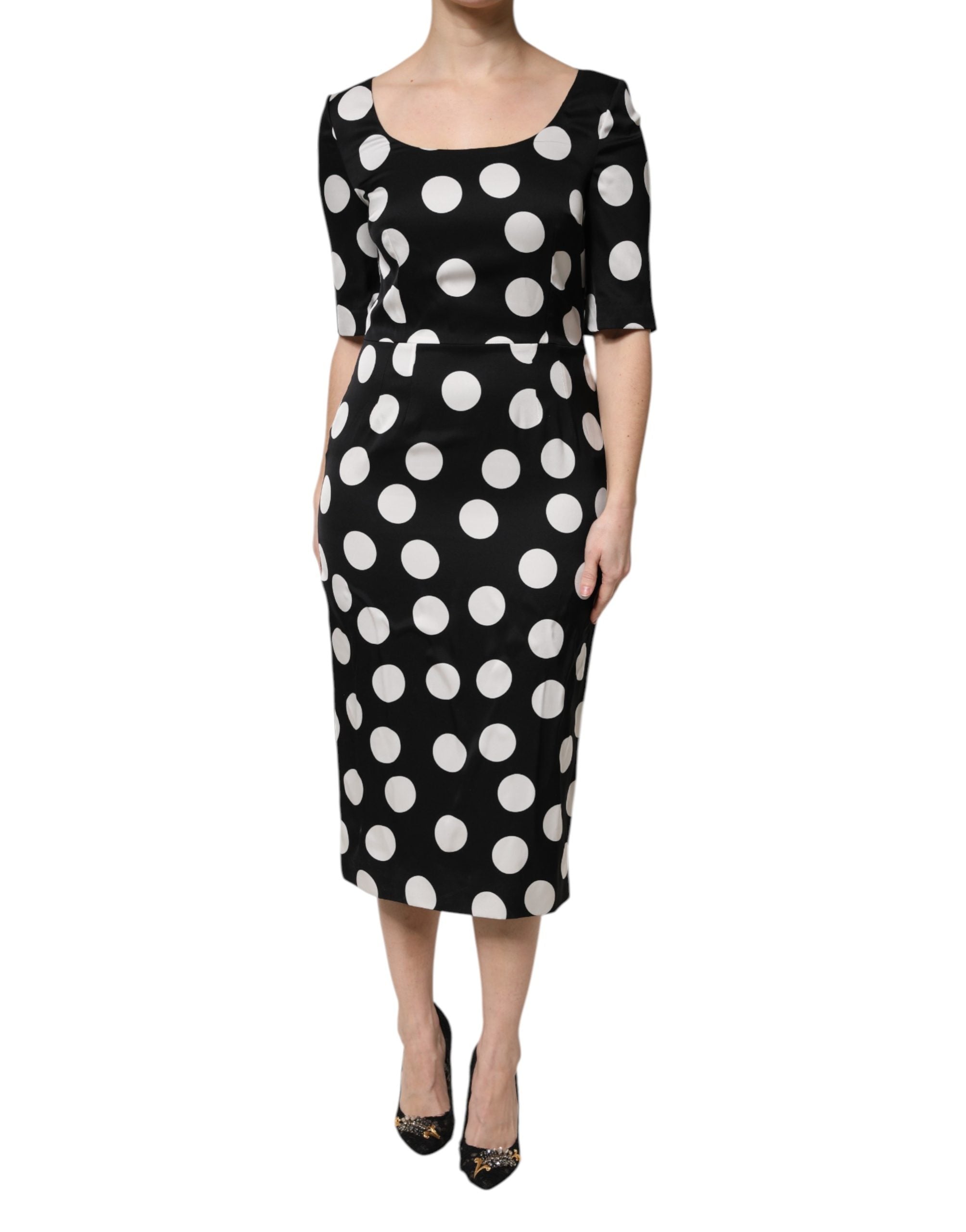 Indulge in the exquisite Dolce & Gabbana Black White Polka Dot Silk Sheath Midi Dress, a timeless piece of luxury crafted in Italy, embodying elegance and sophistication.