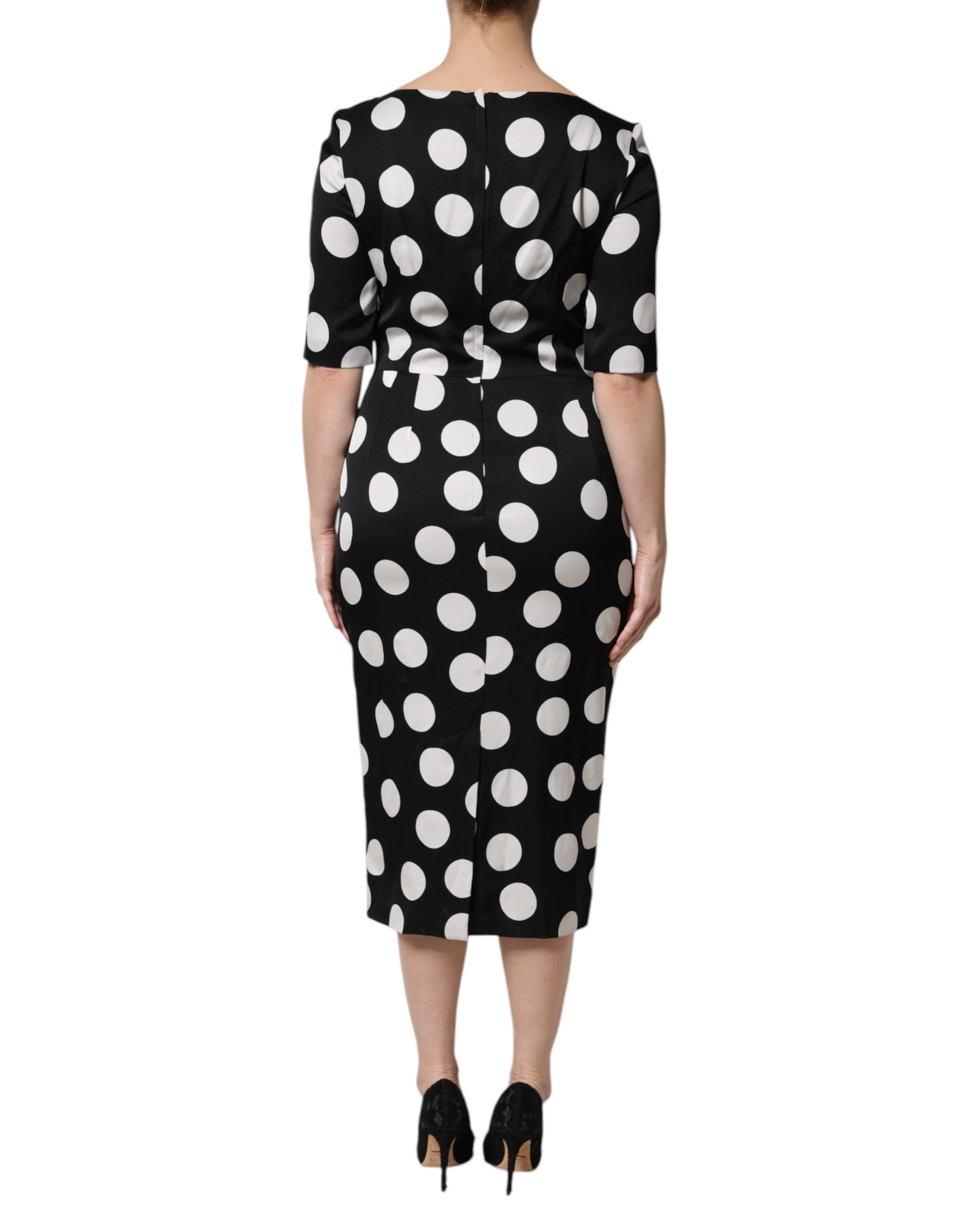 Indulge in the exquisite Dolce & Gabbana Black White Polka Dot Silk Sheath Midi Dress, where luxurious silk meets impeccable Italian craftsmanship for timeless elegance.