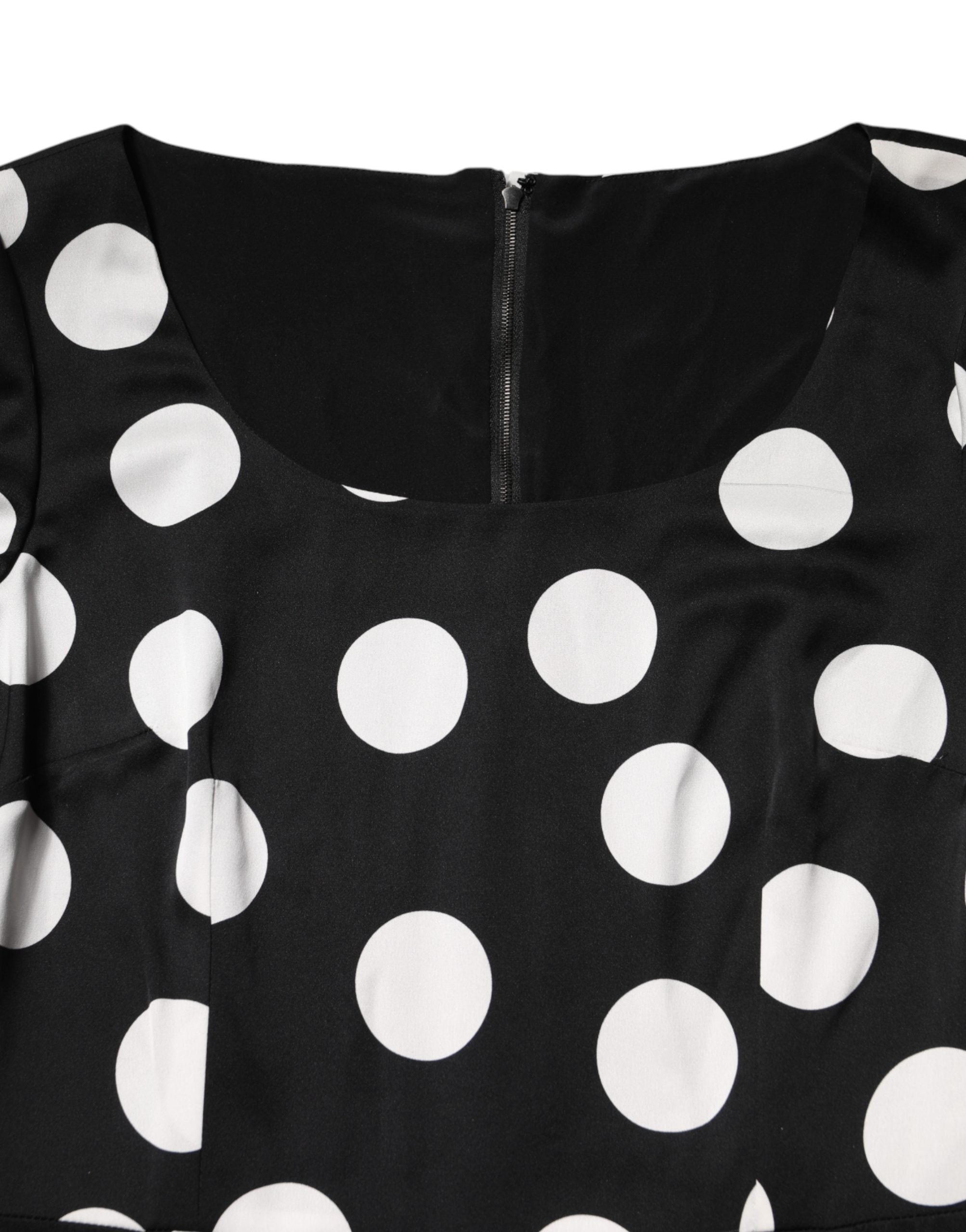 Indulge in the Dolce & Gabbana Black White Polka Dot Silk Sheath Midi Dress, a masterpiece of Italian craftsmanship that embodies timeless elegance and versatile allure.