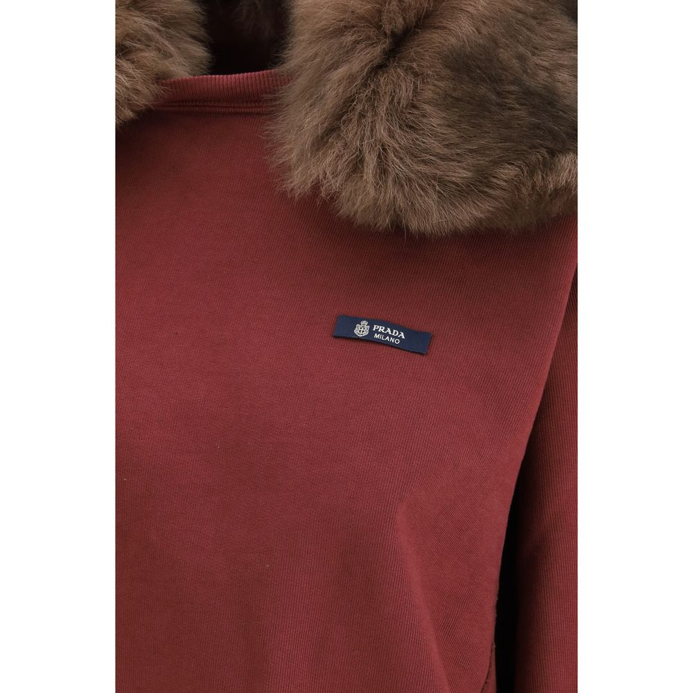 Indulge in the Prada Bordeaux Cotton Sweatshirt, where luxurious 100% cotton meets a sumptuous shearling collar, redefining effortless elegance for the discerning individual.