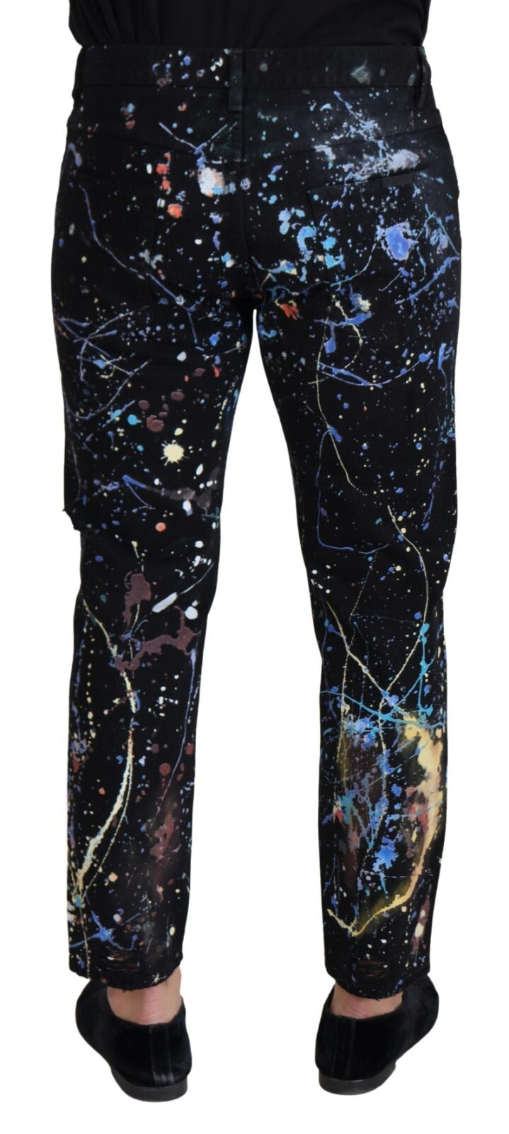 Indulge in the artistry of Dolce & Gabbana's Black Cotton Color Splash Print Denim Jeans, where exquisite craftsmanship meets bold elegance for a timeless statement.