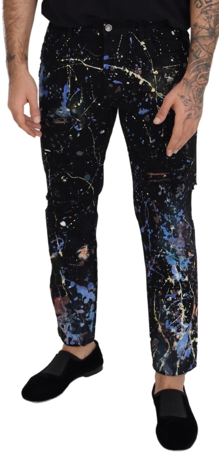 Indulge in the exquisite artistry of Dolce & Gabbana's Black Cotton Color Splash Print Denim Jeans, where bold elegance meets timeless luxury for the discerning individual.
