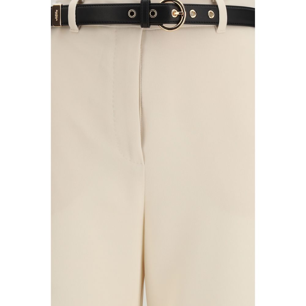 Indulge in the elegance of Max Mara's Beige Triacetate Dress Pants, crafted for a refined silhouette with luxurious materials, perfect for the discerning individual.