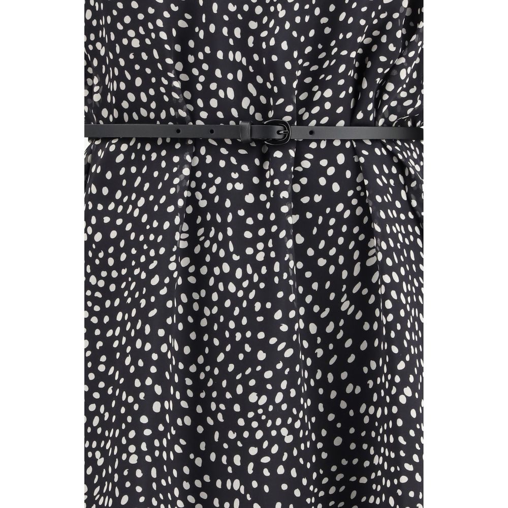 Discover the Max Mara Black Silk Casual Dress, a timeless masterpiece in pure silk, exuding elegance and sophistication for every occasion.