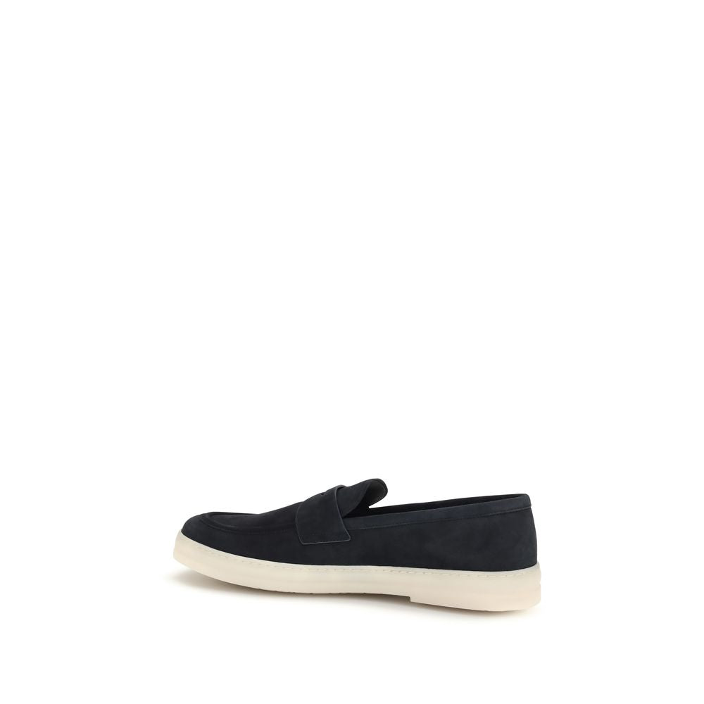 Experience the allure of Prada Blue Calf Leather Bos Taurus Slip-On Loafers, where exquisite craftsmanship meets timeless elegance for the discerning individual.