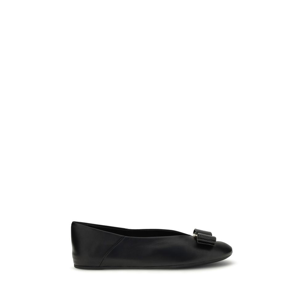 Experience the exquisite artistry of Ferragamo's Black Calf Leather Bos Taurus Ballet Flats, where timeless elegance meets modern sophistication for the discerning individual.