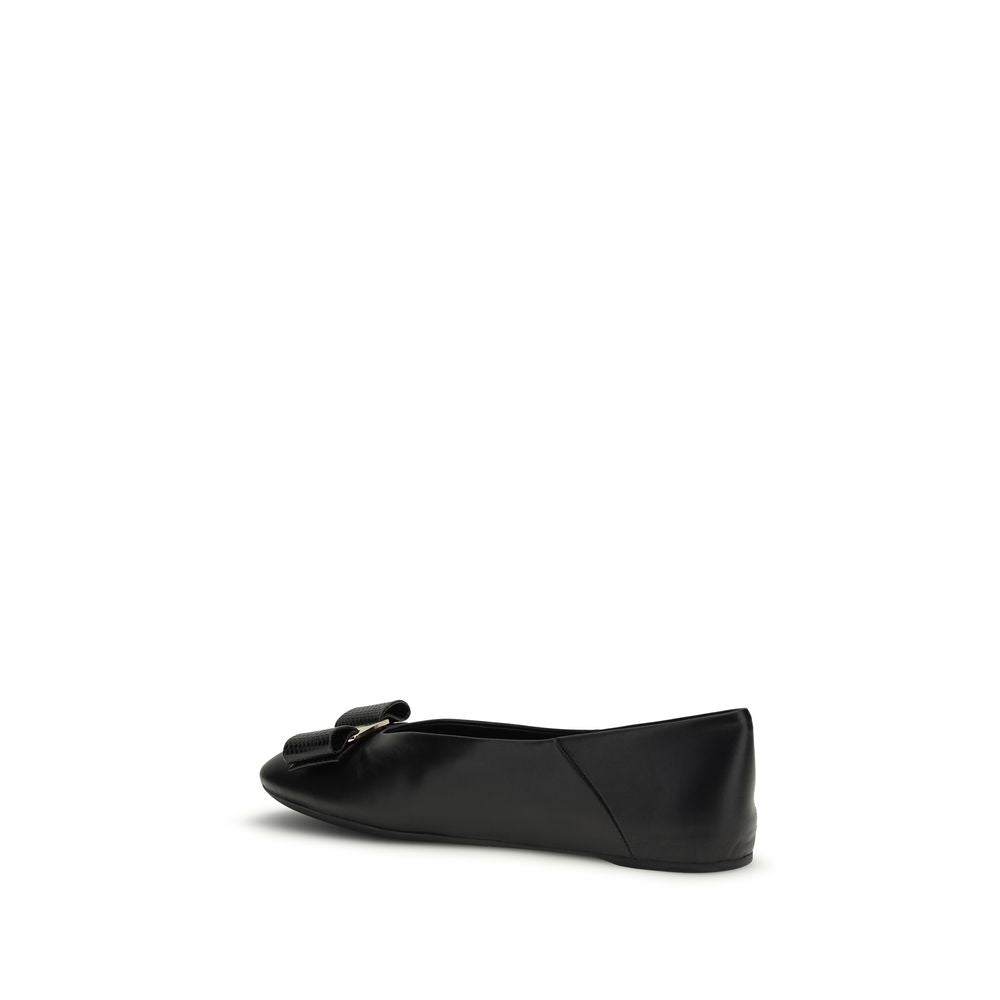 Elevate your elegance with Ferragamo's Black Calf Leather Bos Taurus Ballet Flats, where timeless craftsmanship meets modern sophistication for every occasion.