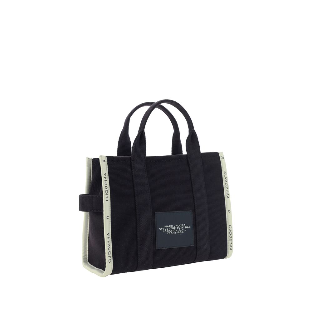 Discover the Marc Jacobs Black Cotton Handbag, a stunning blend of cotton and polyester, embodying luxury and sophistication for the discerning individual.