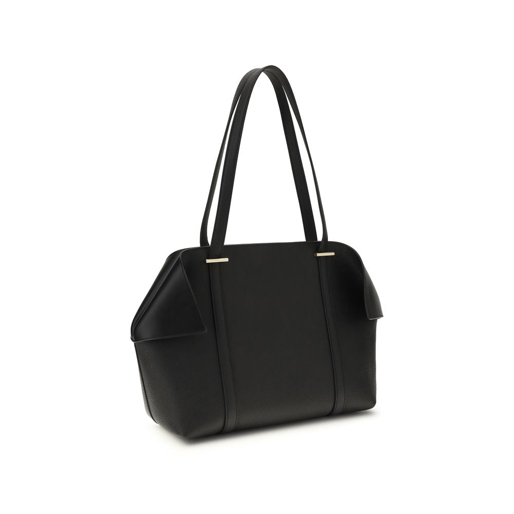 Discover the Ferragamo Black Calf Leather Bos Taurus Shoulder Bag, a masterpiece of Italian craftsmanship that epitomizes timeless elegance and versatile sophistication.