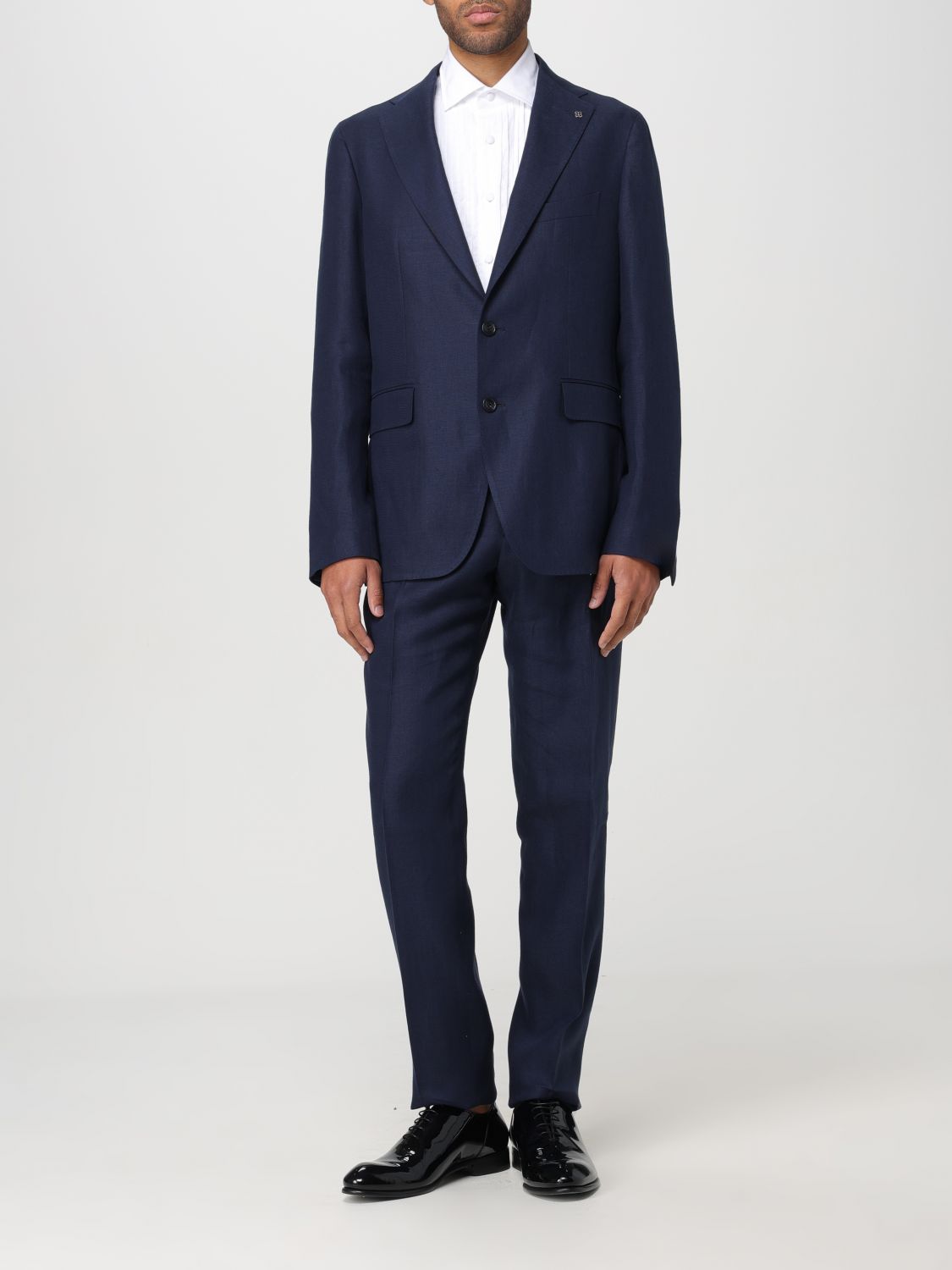 Elevate your presence with the Tagliatore Multicolor Wool Two-Piece Suit, a masterpiece of exquisite linen tailoring that embodies sophistication and allure.