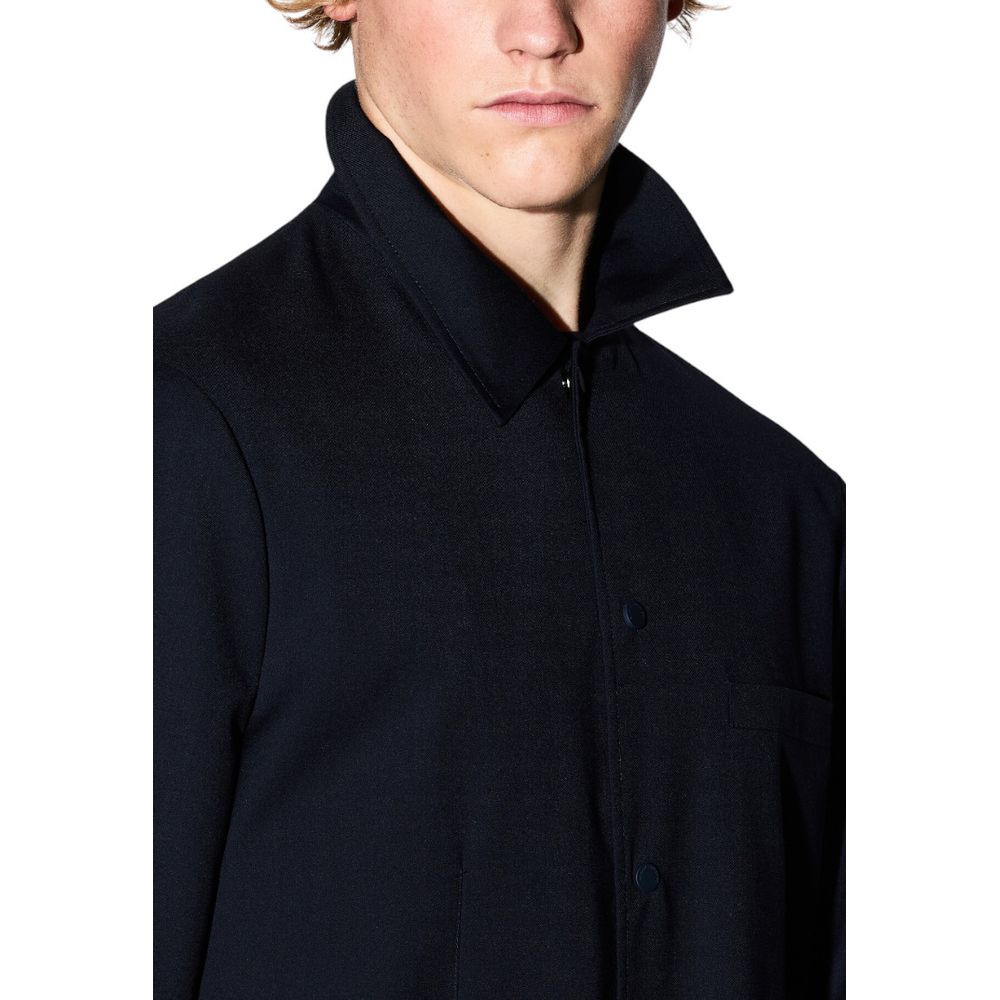Elevate your wardrobe with the Armani Exchange Black Polyester Blazer, a masterful blend of luxury and comfort, perfect for the discerning individual seeking timeless sophistication.
