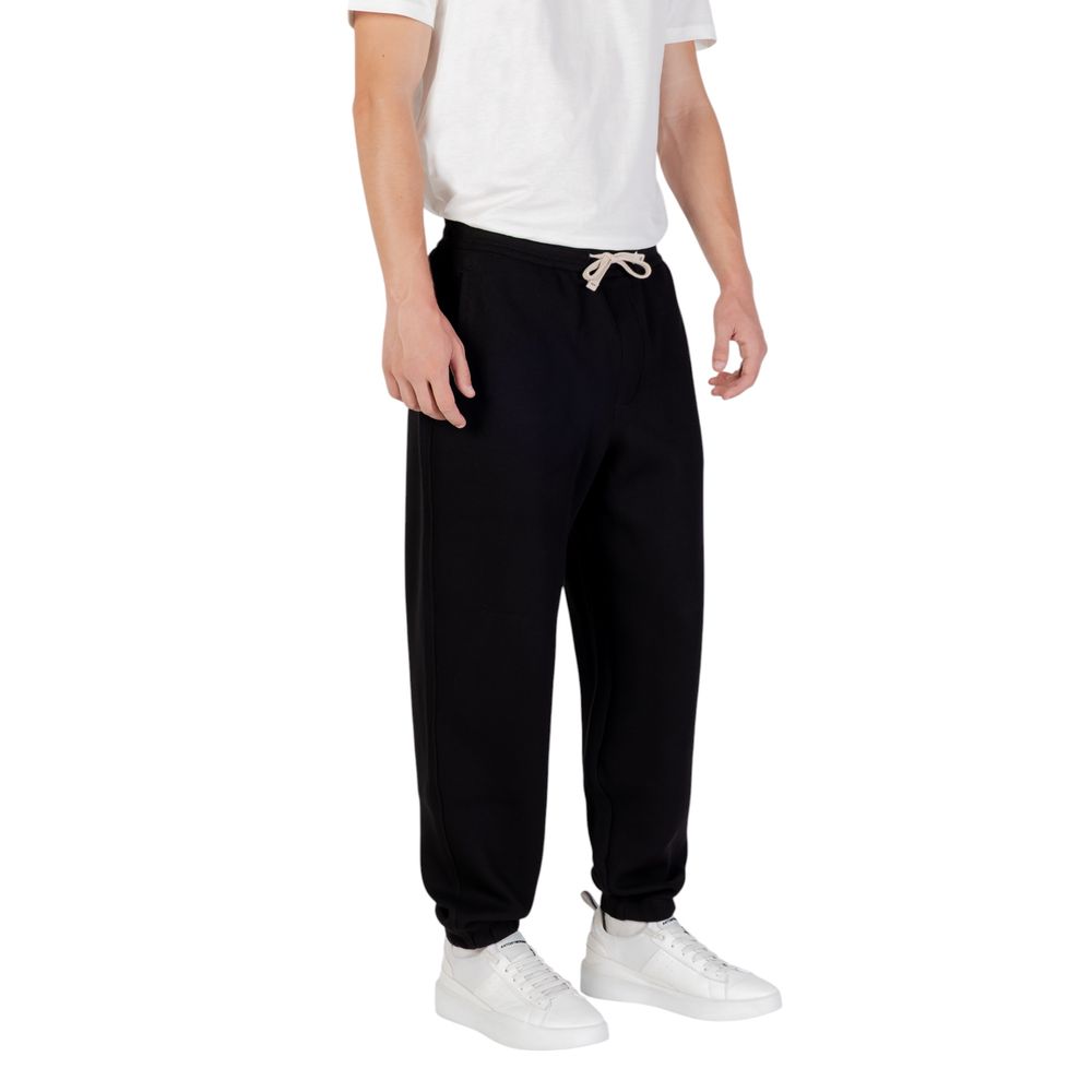 Elevate your wardrobe with Armani Exchange Black Cotton Joggers, crafted from a luxurious blend for unparalleled comfort and timeless sophistication.