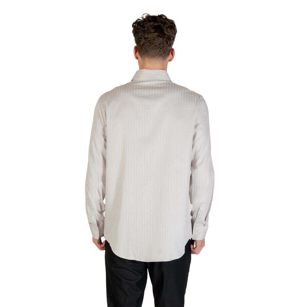 Elevate your wardrobe with the Armani Exchange Gray Cotton Pattern Shirt, crafted from luxurious cotton for timeless elegance and unparalleled comfort, perfect for any occasion.