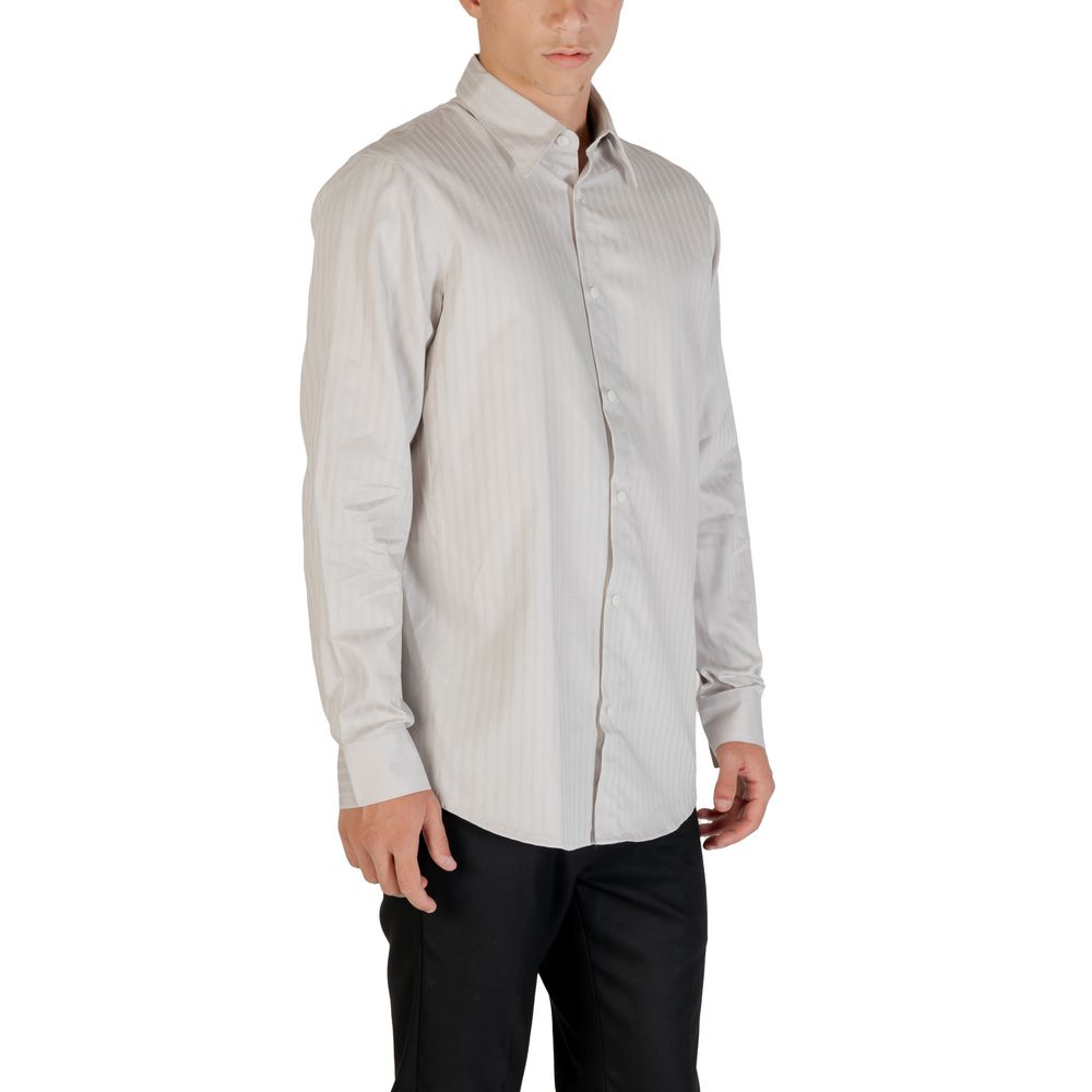 Elevate your wardrobe with the Armani Exchange Gray Cotton Pattern Shirt, crafted from 100% cotton for timeless elegance and unparalleled comfort, perfect for any occasion.